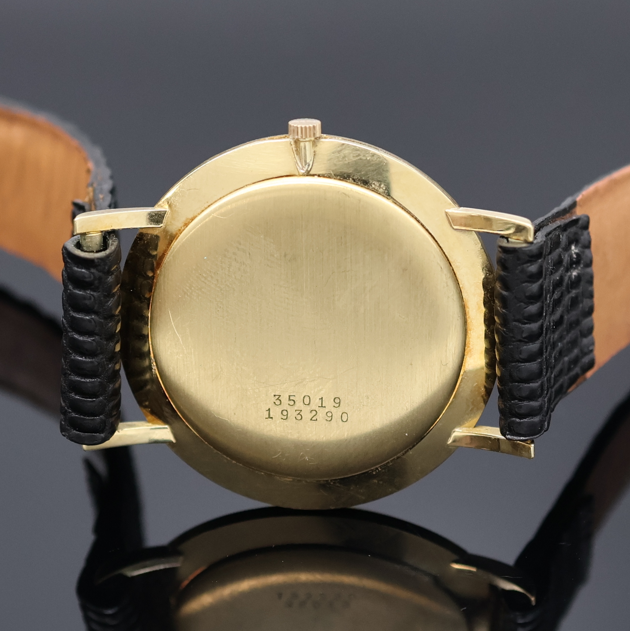 Detail c: BAUME & MERCIER Armbanduhr in GG 750/000, Schweiz um 1965, Handaufzug, Boden u. Glasrand gedr., silb. Zifferbl. m. gold. Std.-Ind. u. Zeigern, kl. ...