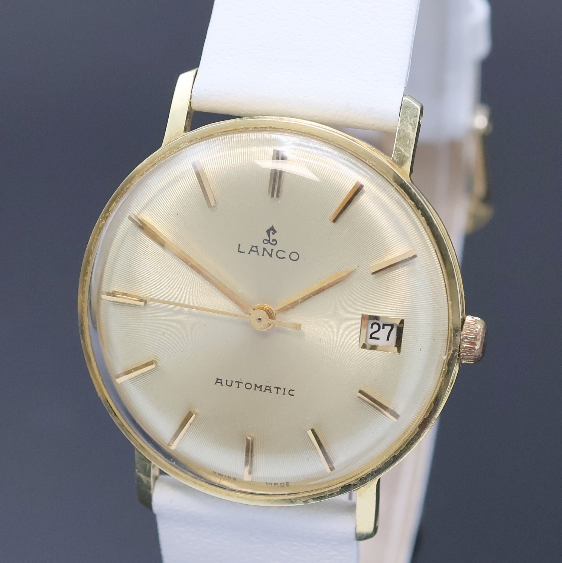 Detail a: LANCO Herrenarmbanduhr in GG 585/000, Schweiz um 1965, Automatik, Boden u. Glasrand gedr., goldfarb. Zifferbl. m. gold. Std.-Ind. u. gold. Zeiger, ...