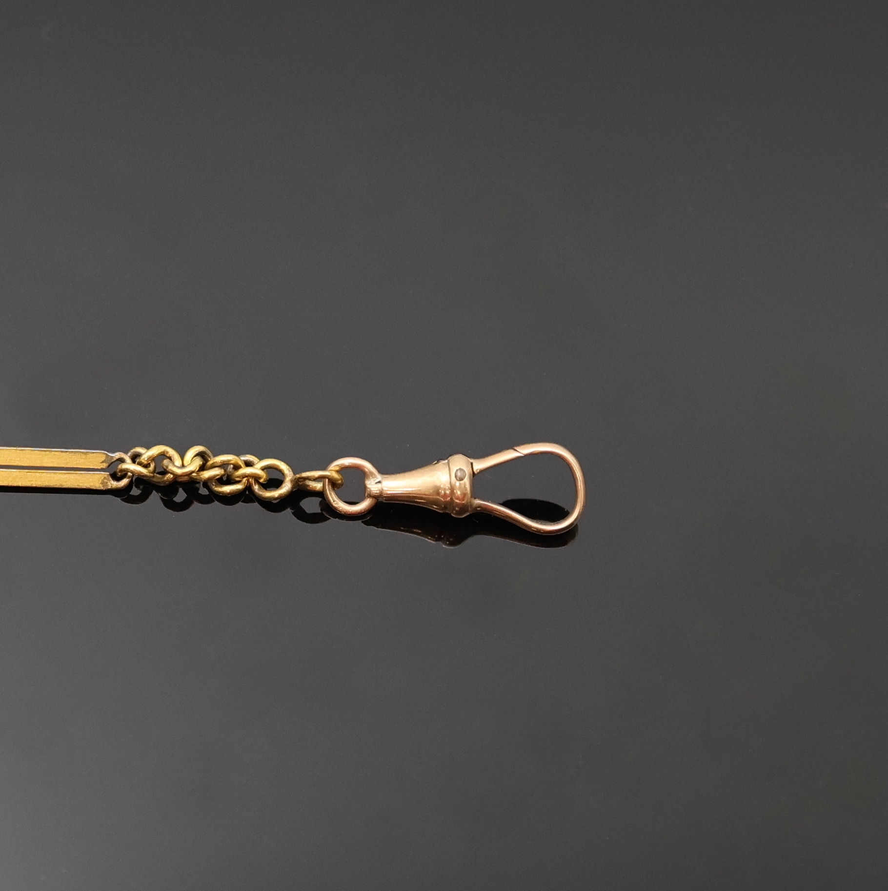 Detail a: Taschenuhrkette in GG 585/000, mit Federring und Karabiner, L. ca. 30 cm, Gew. ca. 11g, aus Sammlungsauflösung