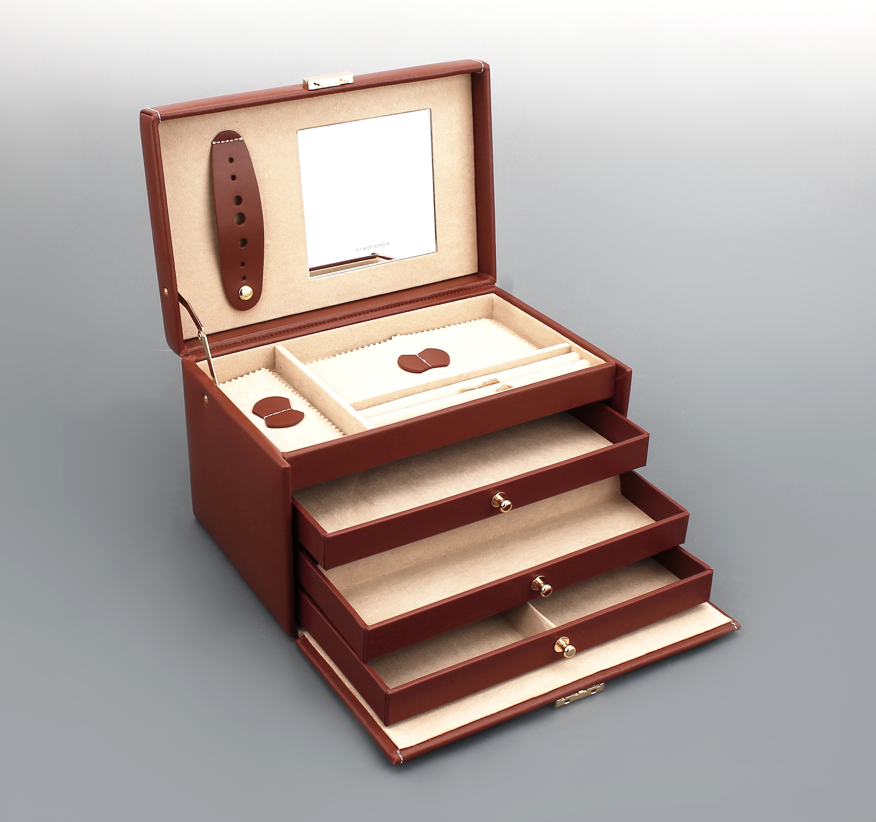 Detail a: Schmuckkoffer aus braunem Leder, Inneneinrichtung aus beigefarb. Velour, Broschenleiste, Spiegel im Deckel, Ringleiste,zwei Fächer mit Abdeckkissen, ...