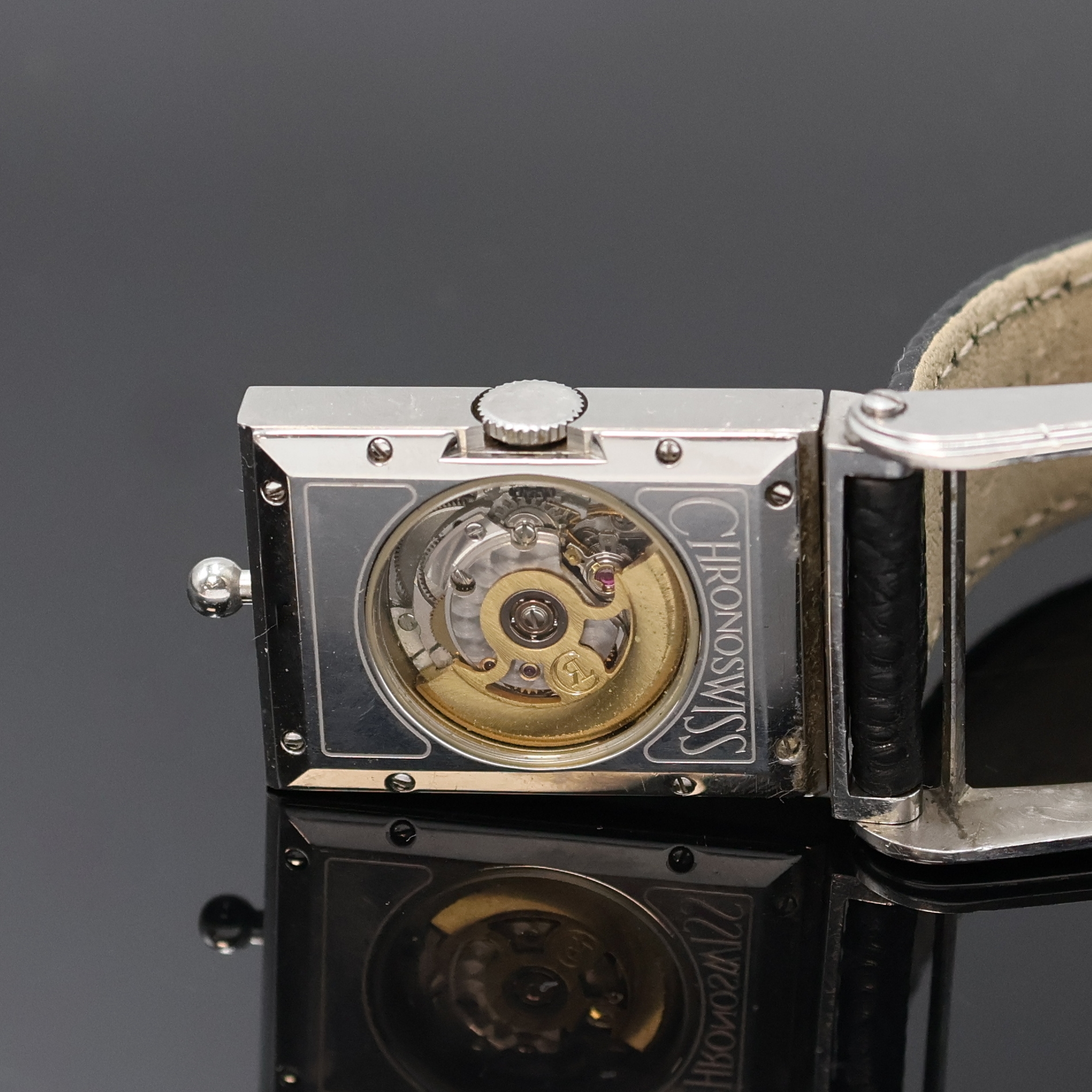 Detail d: CHRONOSWISS Cabrio Armbanduhr in Stahl, Schweiz um 1995, Automatik, beids. vergl., ausklappbares Wendegeh., Boden 8-fach verschr., silb. Zifferbl. ...
