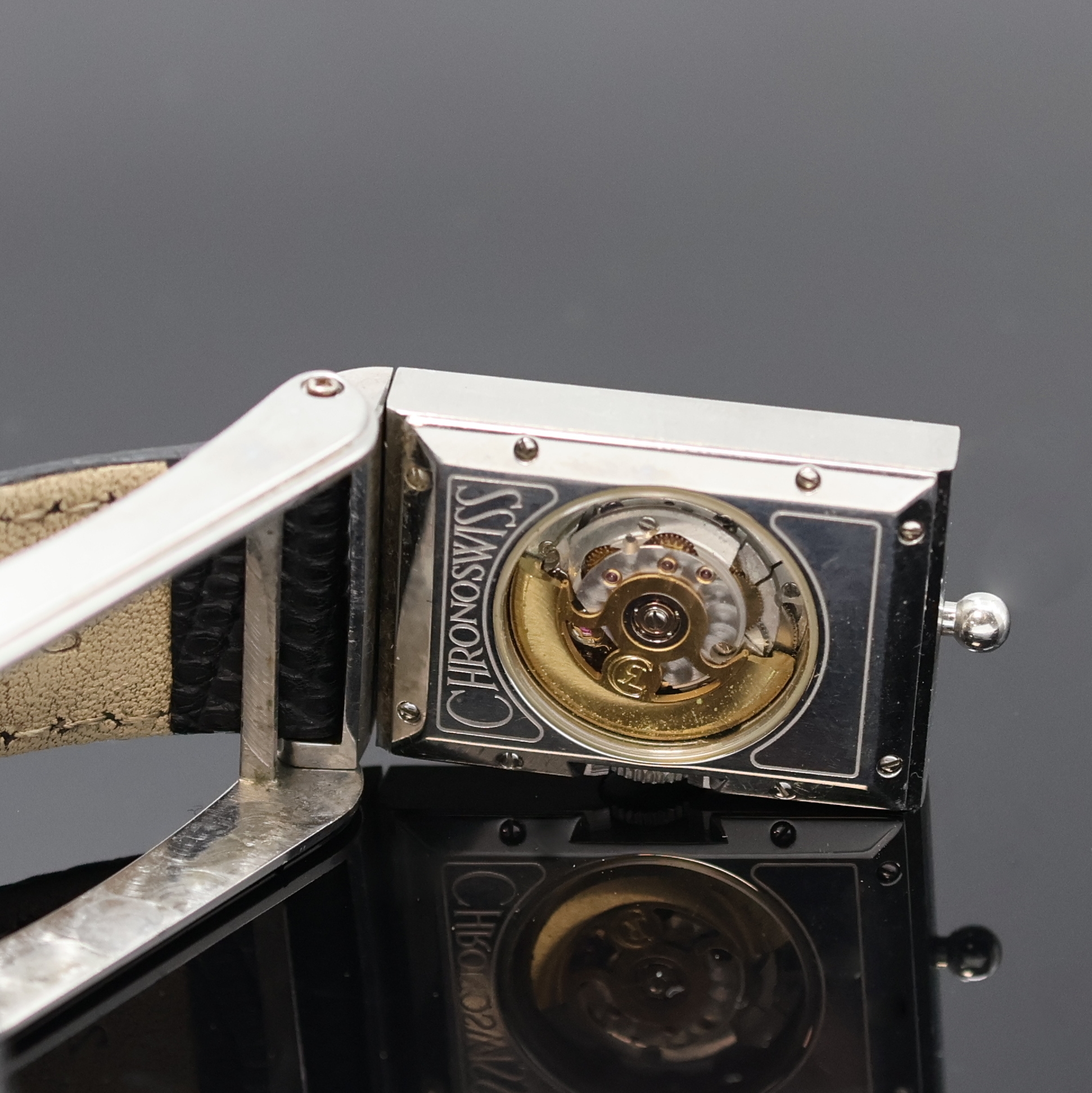 Detail e: CHRONOSWISS Cabrio Armbanduhr in Stahl, Schweiz um 1995, Automatik, beids. vergl., ausklappbares Wendegeh., Boden 8-fach verschr., silb. Zifferbl. ...