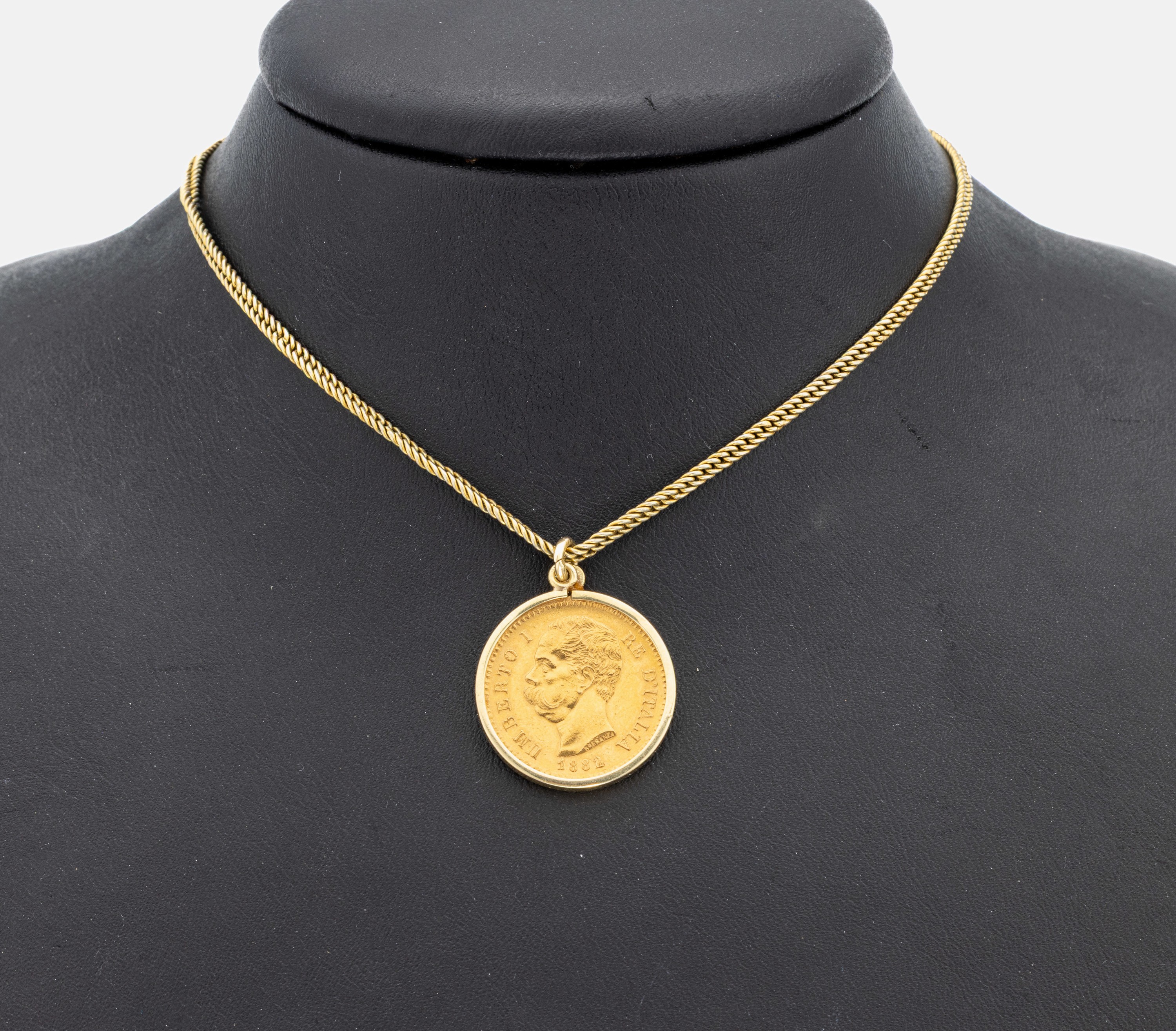 8 kt Gold Münz-Anhänger, GG 333/000 gepr., lose gefasste Goldmünze, 20 Lire, Italien 1882, Umberto I., an Kette, Metall verg., L. ca. 51 cm, ...