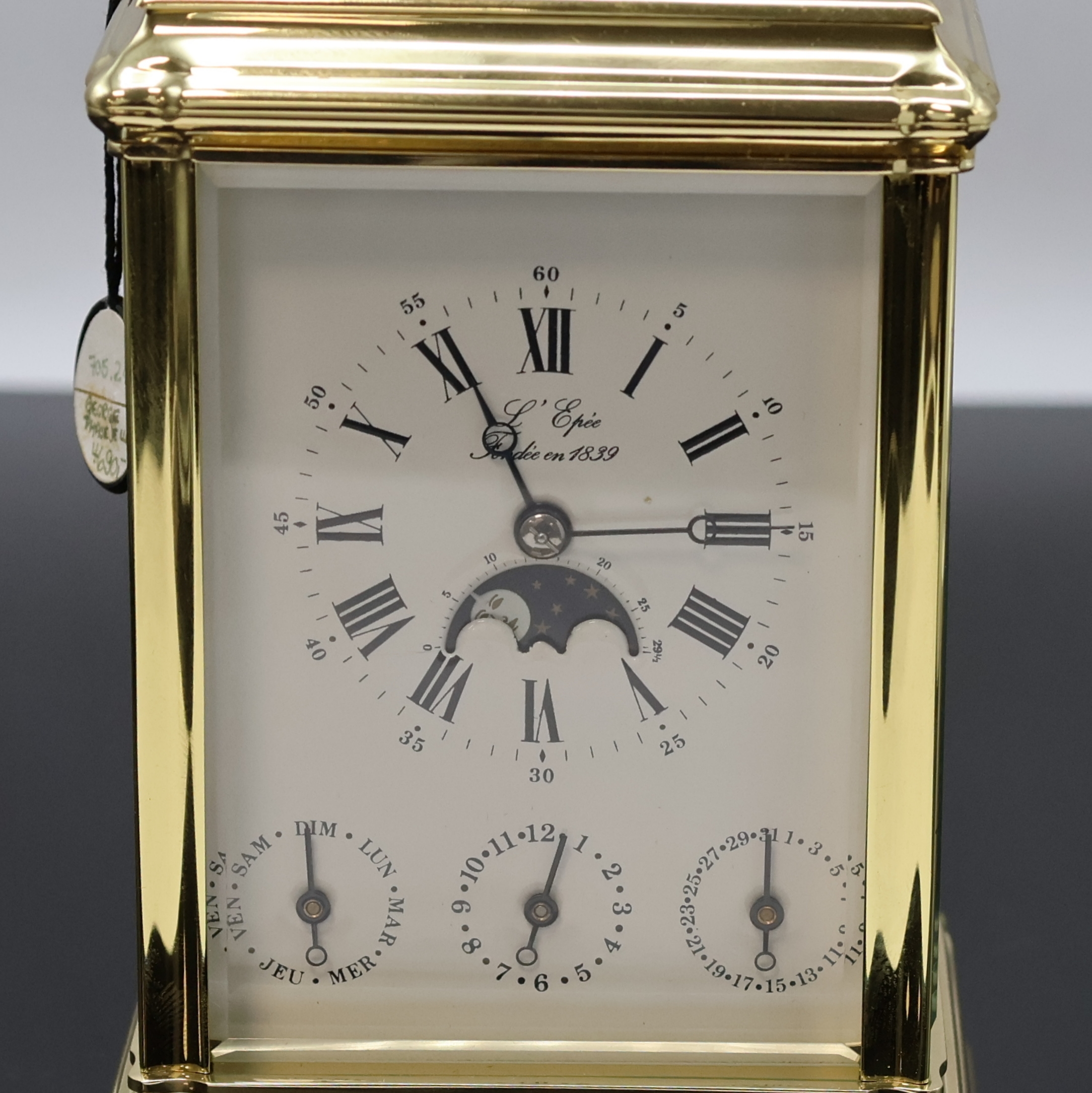 Detail a: L´Epée Reiseuhr mit 1/2-Stundenschlag, Wecker, Repetition und Kalender mit Mondphase, Frankreich um 1995, Messinggeh., 5-seitig facettiert vergl., ...