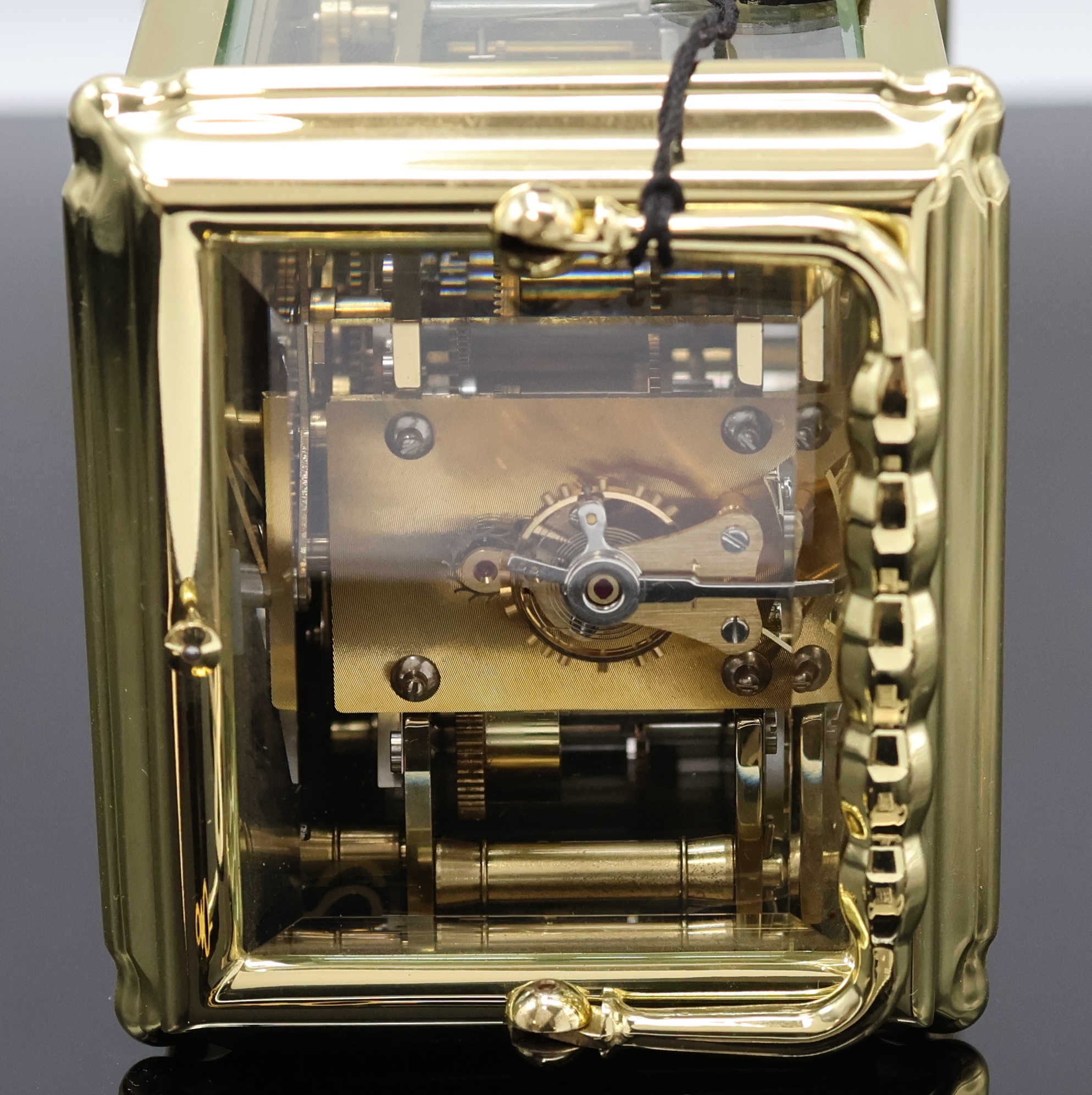 Detail e: L´Epée Reiseuhr mit 1/2-Stundenschlag, Wecker, Repetition und Kalender mit Mondphase, Frankreich um 1995, Messinggeh., 5-seitig facettiert vergl., ...