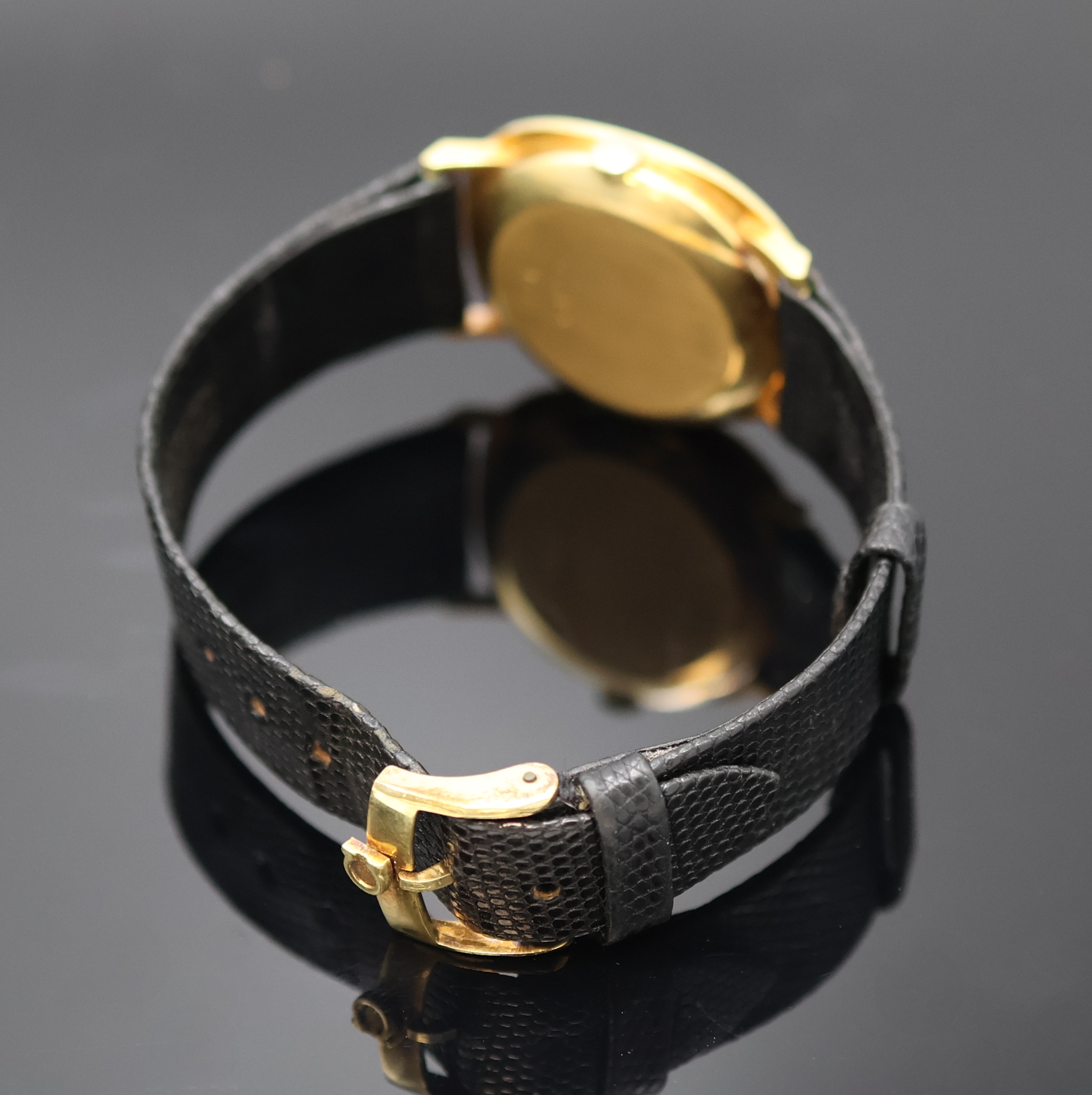 Detail b: CONSUL Armbanduhr in GG 750/000, Handaufzug, Schweiz um 1970, Boden aufgedr., Lünette gebürstet, gold. Zifferbl. m. aufgel. Indizes, Anz. v. Std. ...