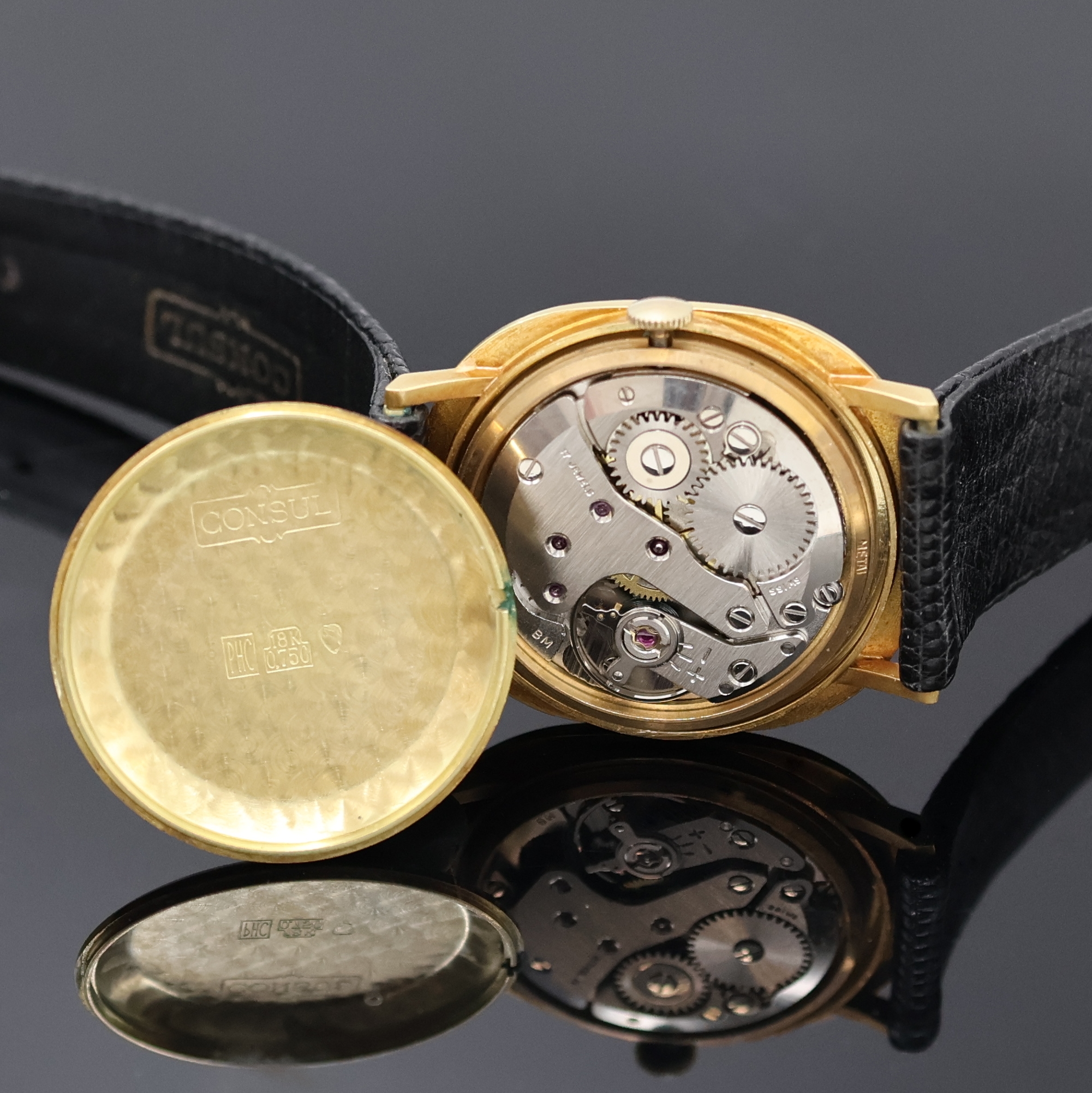 Detail e: CONSUL Armbanduhr in GG 750/000, Handaufzug, Schweiz um 1970, Boden aufgedr., Lünette gebürstet, gold. Zifferbl. m. aufgel. Indizes, Anz. v. Std. ...
