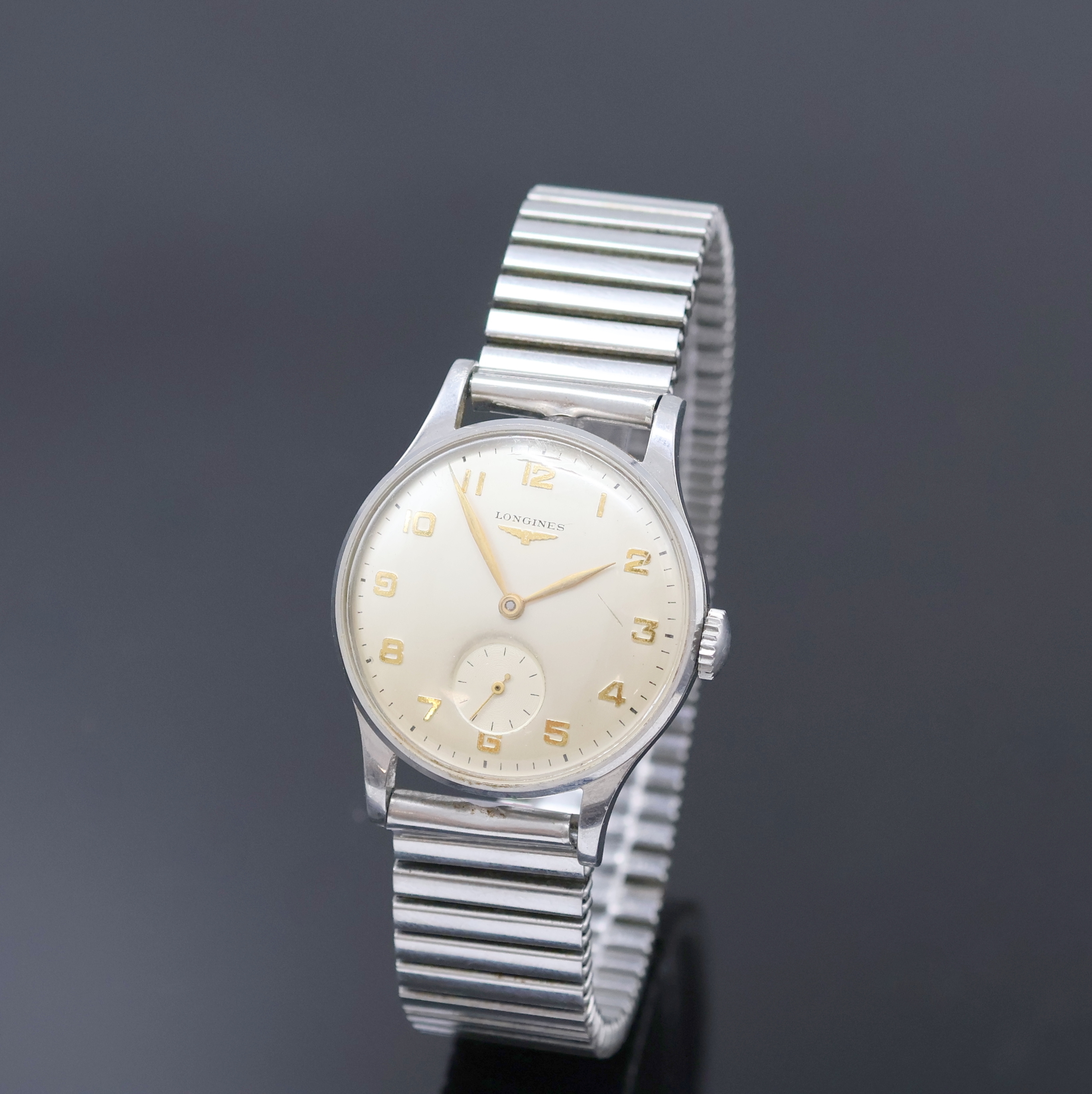LONGINES Herrenarmbanduhr Referenz 4858 12, Handaufzug, Schweiz um 1952, 3-teil. Stahlgeh. an Fixo-Flex Band, Boden und Glasrand aufgedr., silb. ...