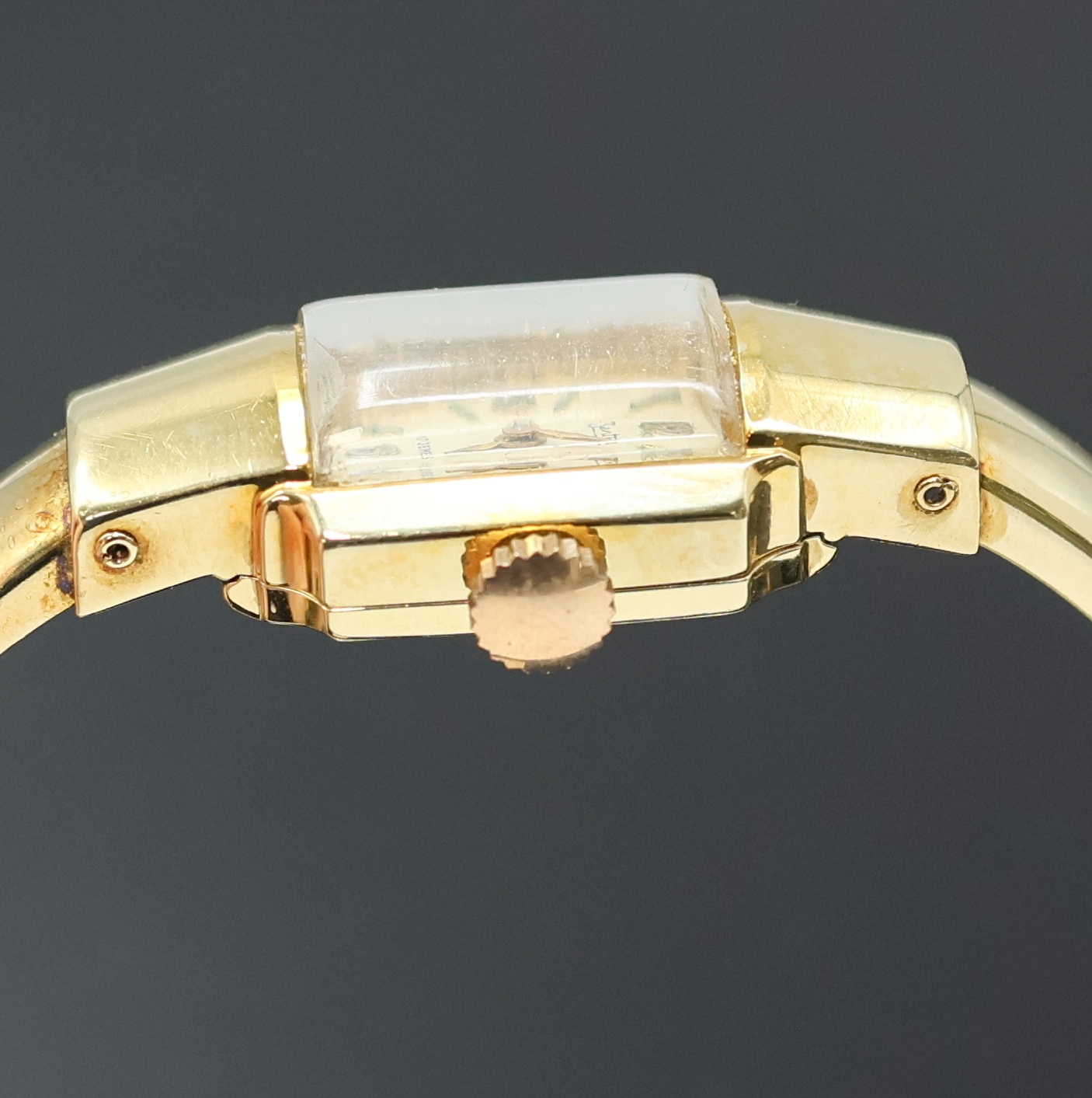 Detail b: ZENTRA Damenspangenuhr in GG 585/000, Schweiz um 1940, Handaufzug, Boden aufgedr., silb. Zifferbl. fl., gold. Std.-Ind. u. Zeiger, Ankerwerk, ...
