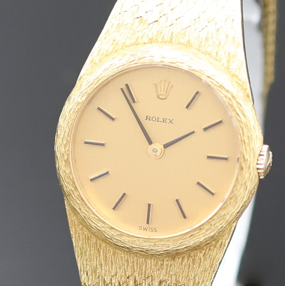 Detail a: ROLEX Damenarmbanduhr in GG 750/000, Schweiz um 1965, Handaufzug, Boden aufgedr., orig. Goldband, Champagnerfarb. Zifferbl. m. aufges. Std.-Ind., ...