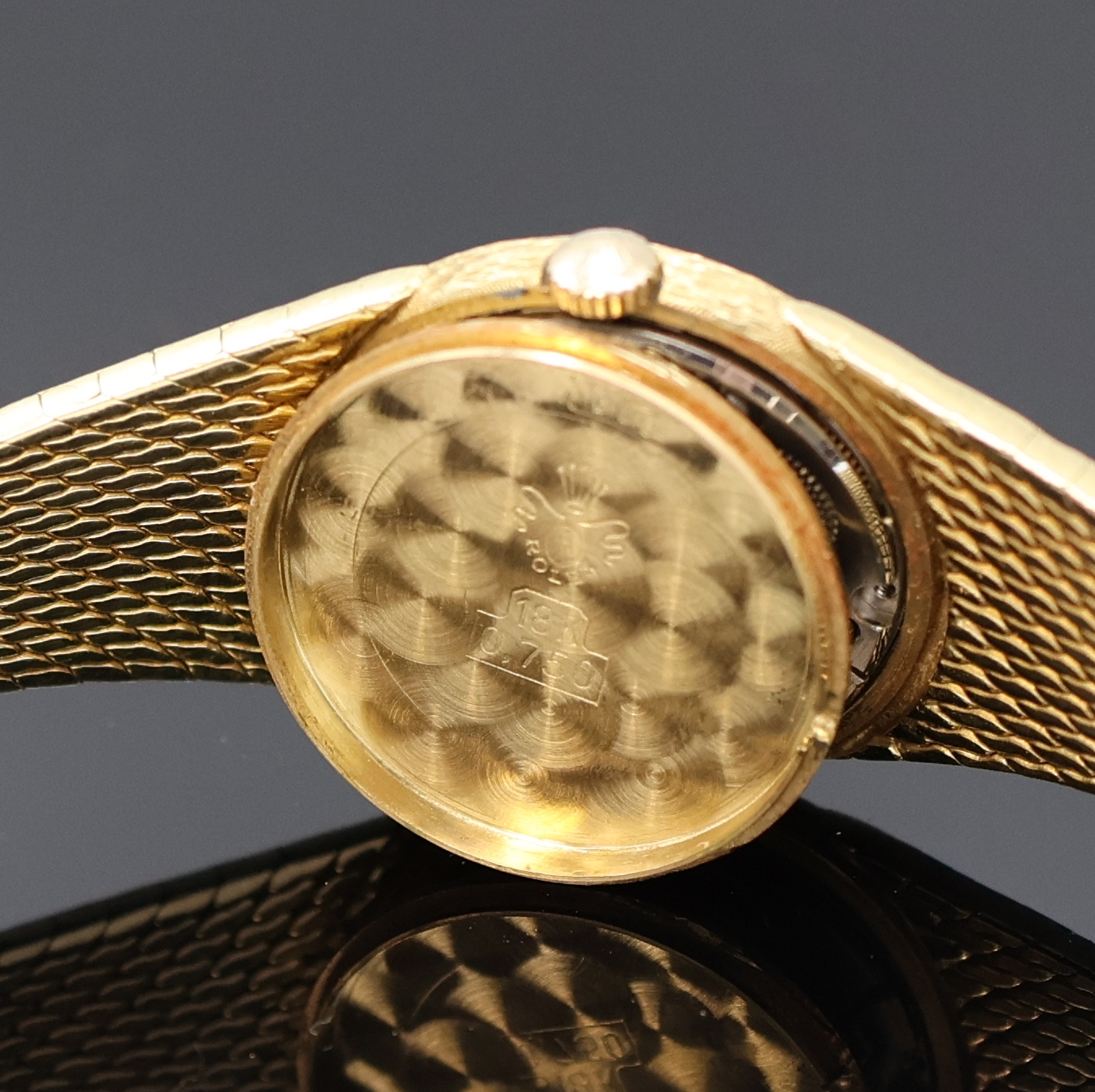 Detail e: ROLEX Damenarmbanduhr in GG 750/000, Schweiz um 1965, Handaufzug, Boden aufgedr., orig. Goldband, Champagnerfarb. Zifferbl. m. aufges. Std.-Ind., ...