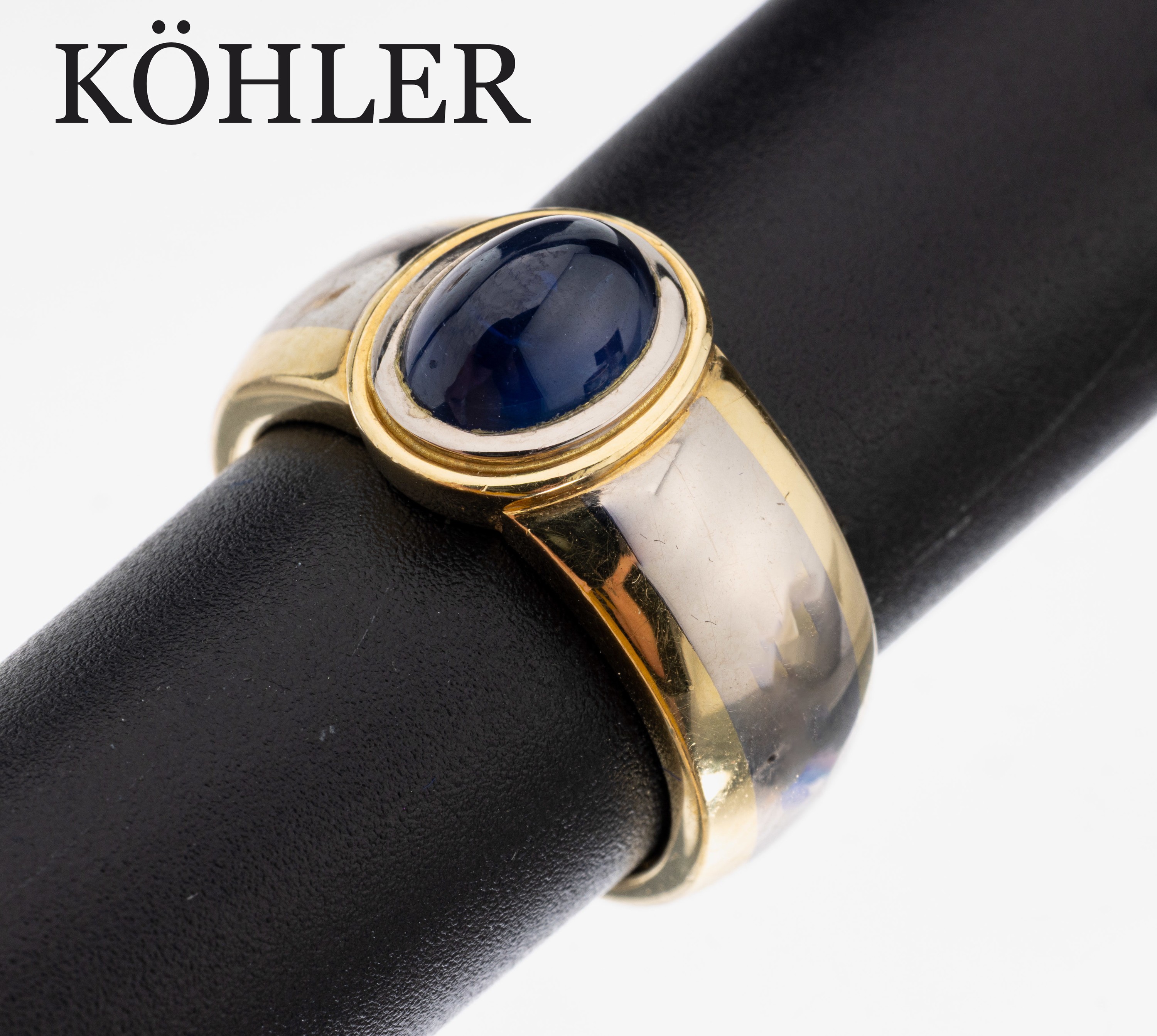 18 kt Gold Saphir-Ring, GG/WG 750/000, in WG gefasster ovaler Saphir-Cabochon ca. 3.11 ct, RW 57, ca. 14 g, Meistermarke KÖHLER/Schwäbisch Gmünd