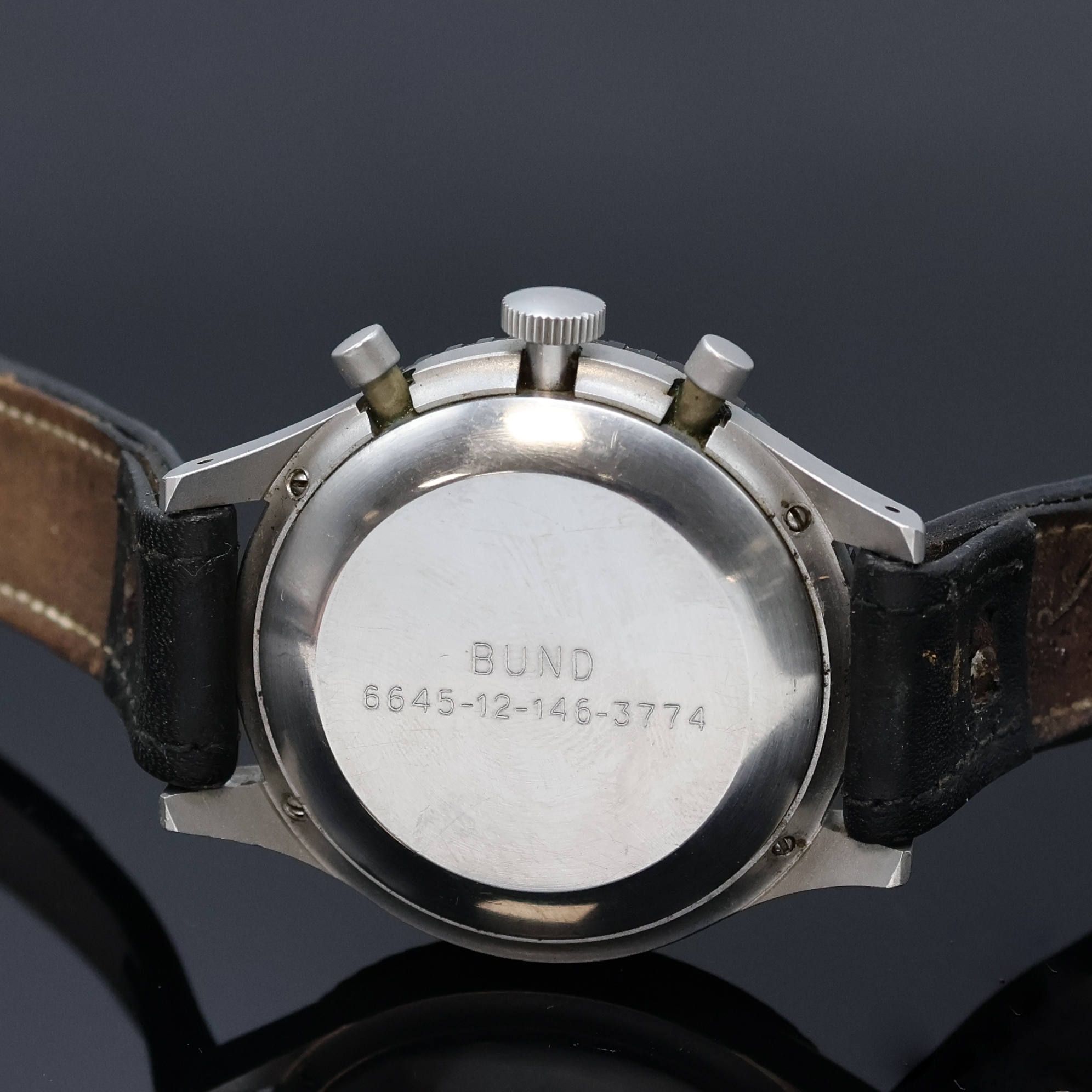 Detail e: HEUER 3H Flieger-Schaltradchronograph mit Flyback, Schweiz um 1970, Handaufzug, mattiertes Geh. 4-fach verschr., Boden m. Versorgungsnummer ...