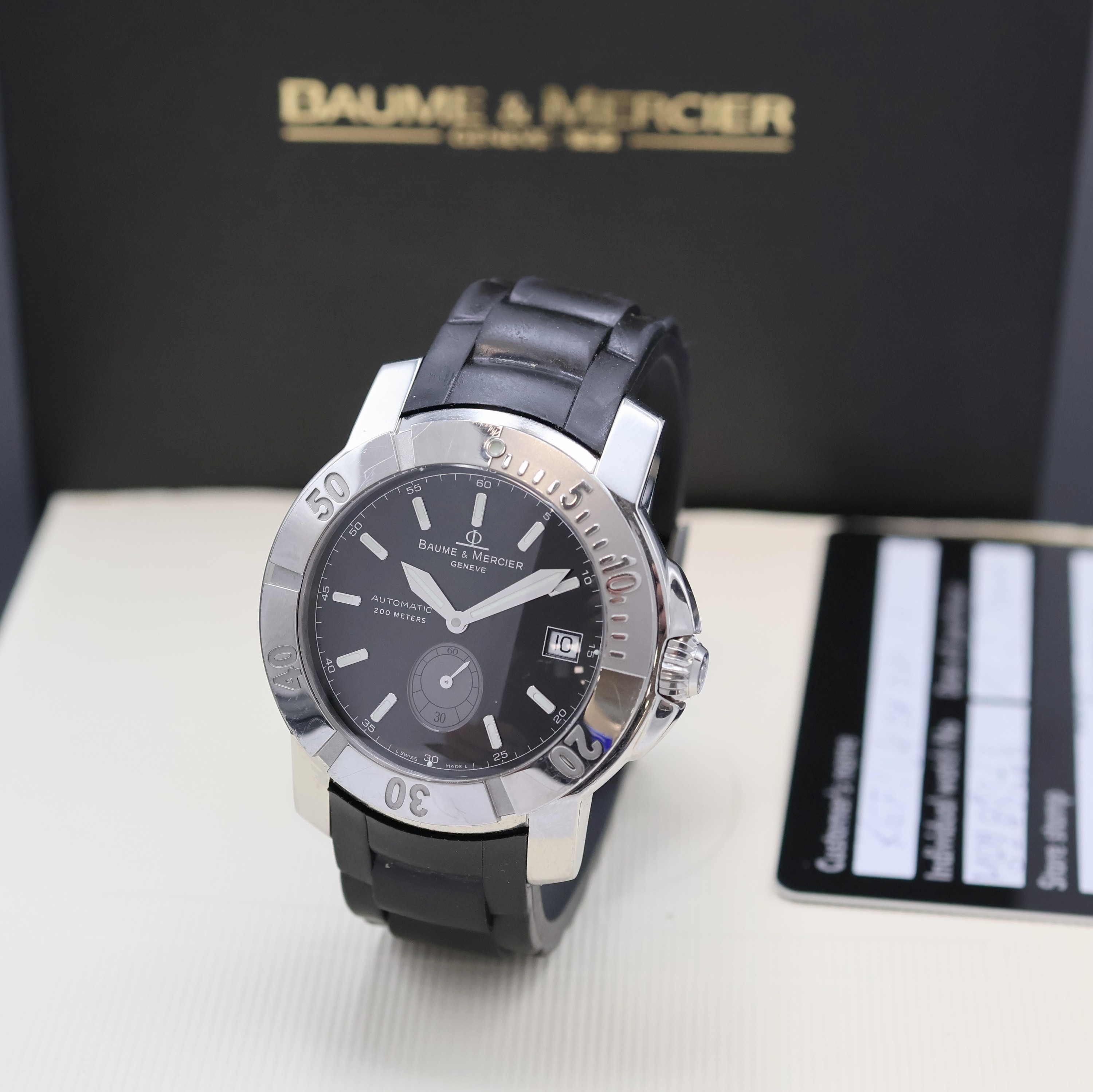 BAUME & MERCIER Capeland Herrenarmbanduhr Referenz 65353, Schweiz verk. lt. Pap. 02/2011, Automatik, Boden u. Krone verschr., orig. Kautschukband m. ...