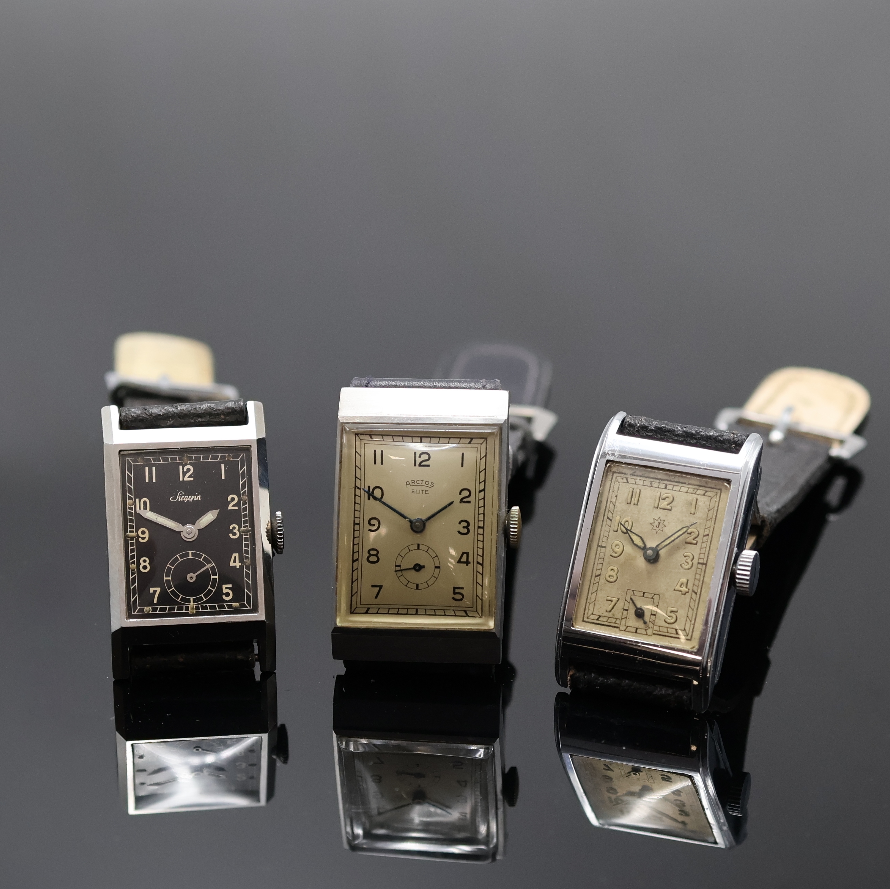 ARCTOS/UROFA 58 sowie 2 weitere rechteckige Armbanduhren, Handaufzug, 1) Arctos Elite, 2-tlg. Stahlgeh., silb. Zifferbl., gebl. Zeiger, versilb. Werk ...