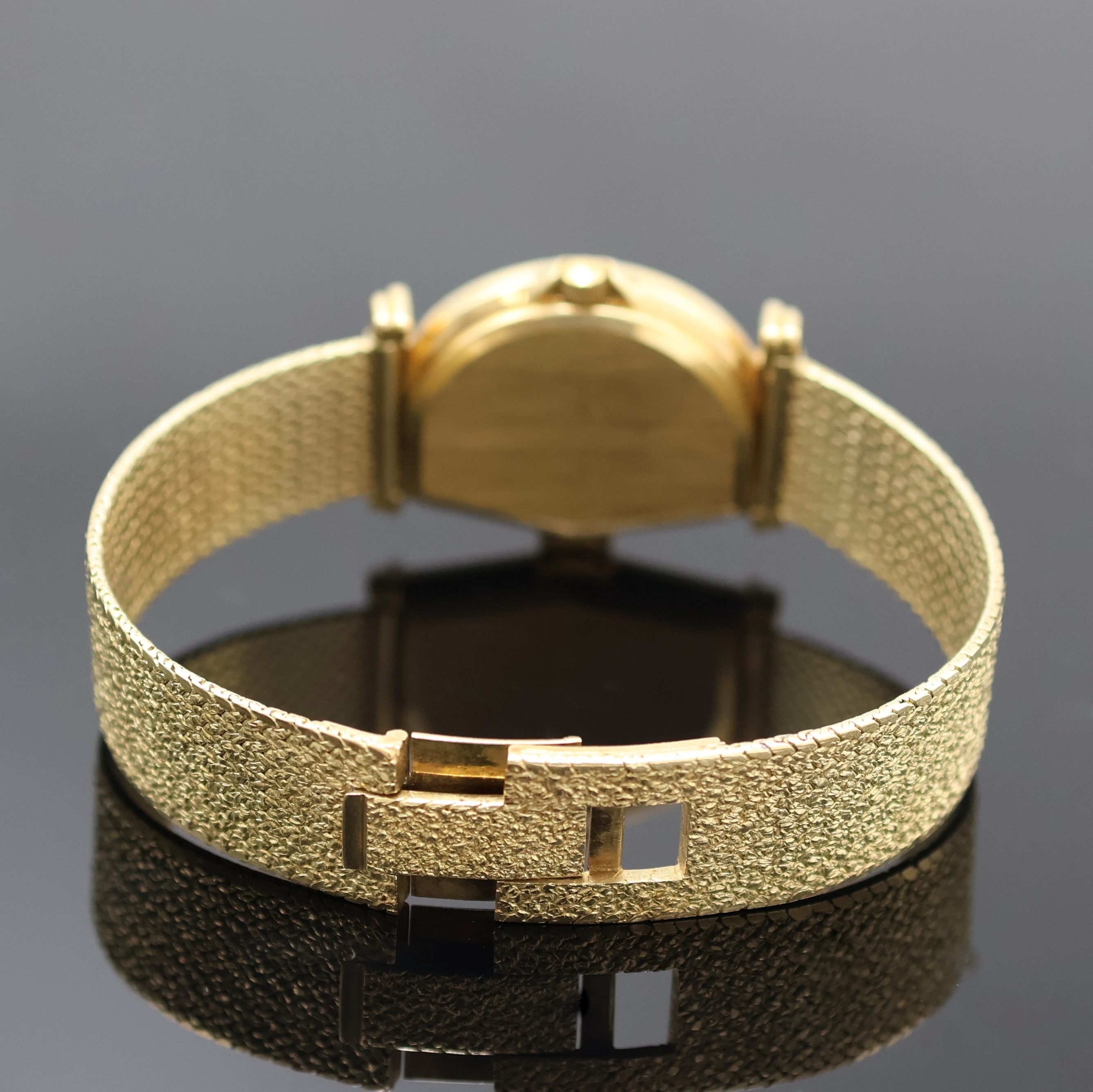 Detail b: JEAN D'EVE Sectora vergoldete Armbanduhr an GG 585/000 Band, Schweiz um 1990, quarz, asym. Gehäuse, Boden aufgedr., cremefarb. Zifferbl. mit ...