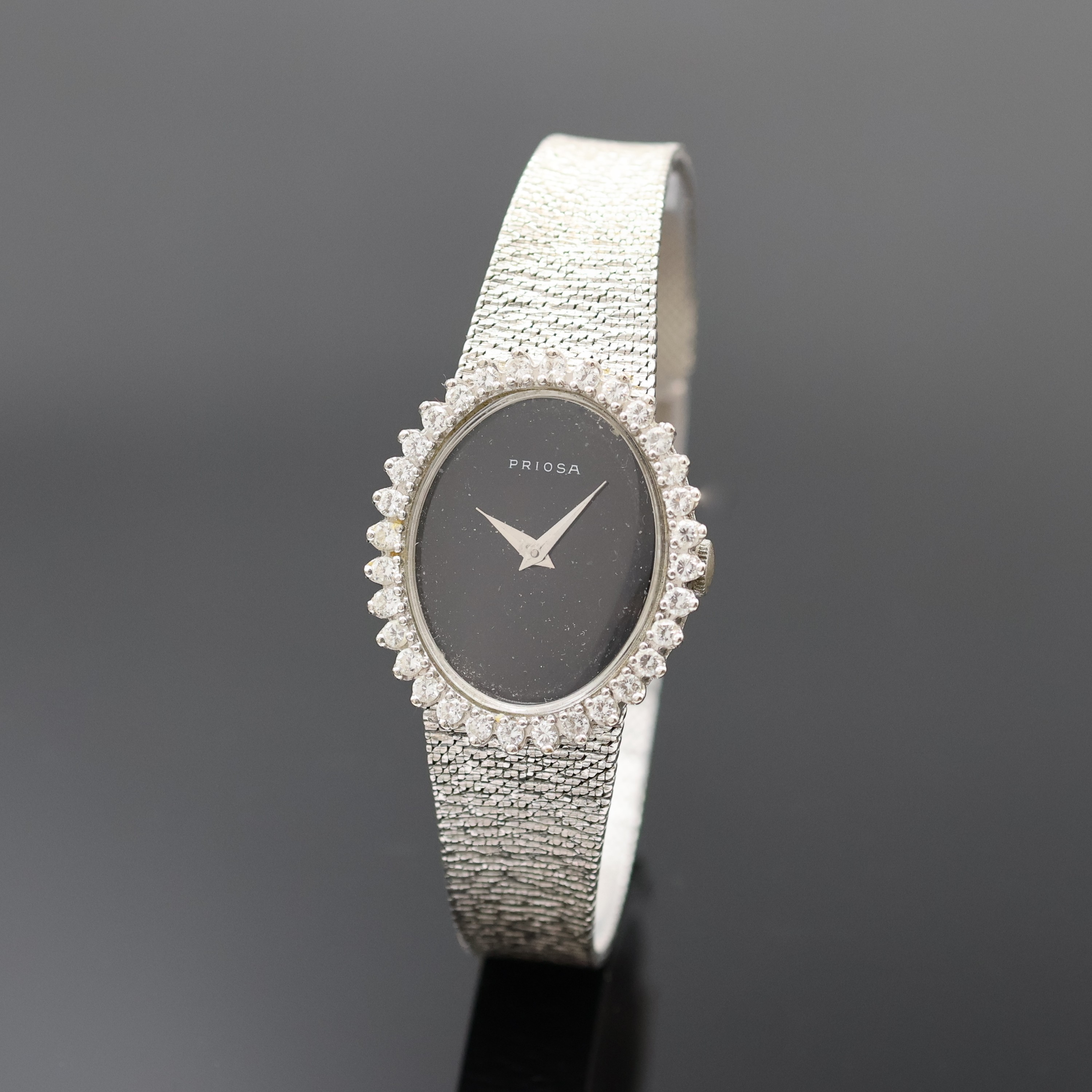 PRIOSA Damenarmbanduhr in WG 585/000 mit Diamanten, Schweiz um 1965, Handaufzug, Boden aufgedr., Goldband, Lünette aufw. m. Diamanten bes., ...