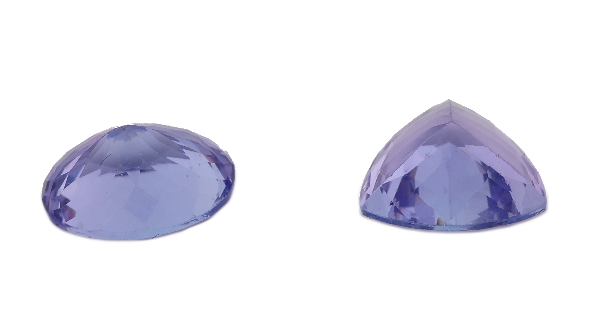 Detail a: Konvolut 2 lose Tansanite: 1 x facett. Triangel-Schliff ca. 1.98 ct, ca. 7.86 mm; 1 x oval facett. ca. 2.04 ct, ca. 6.6 x 8.5 mm