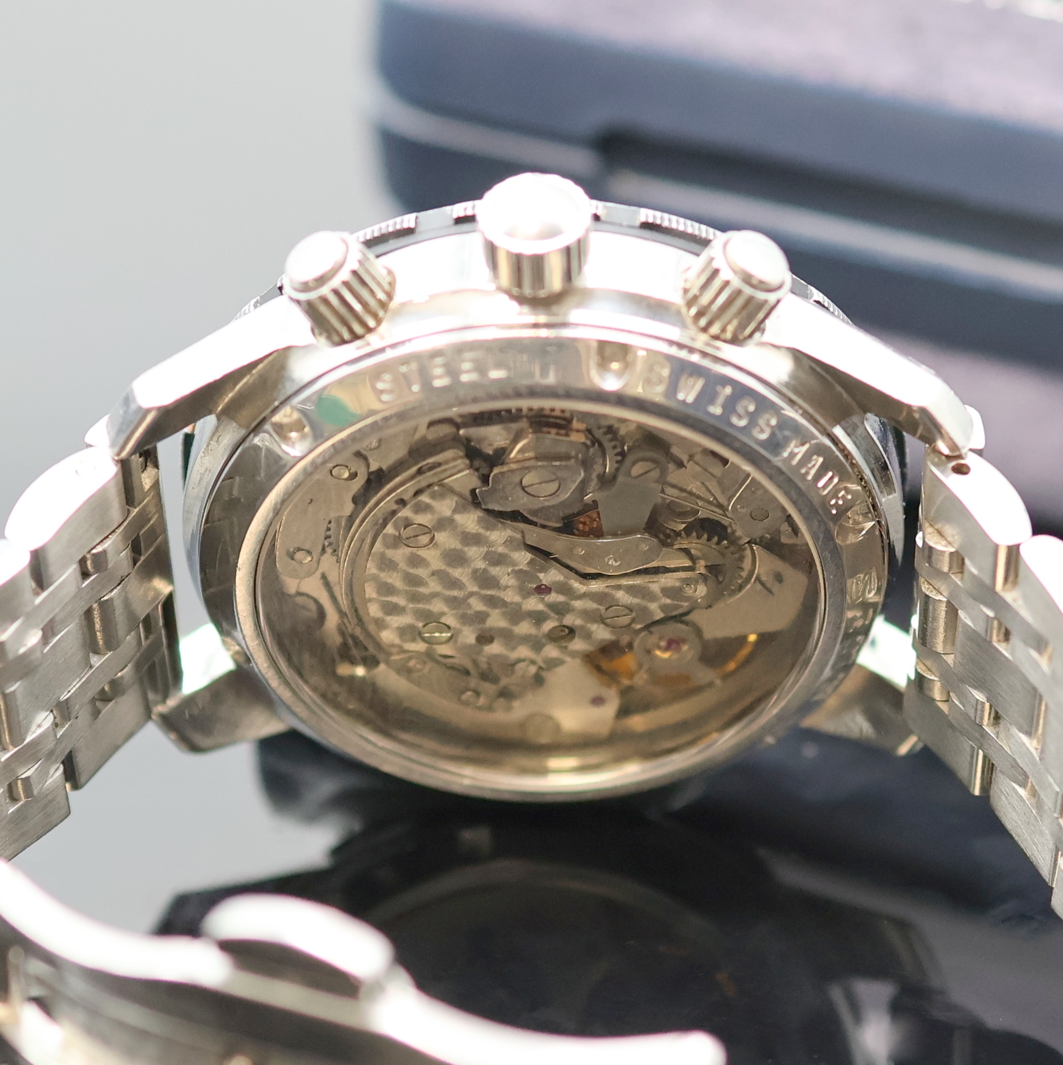 Detail d: SINN Armbanduhr mit Chronograph, Schweiz/Deutschland um 1990, beids. vergl., Boden und Drücker verschr., neutr. Gliederband m. dopp. Faltschl., ...