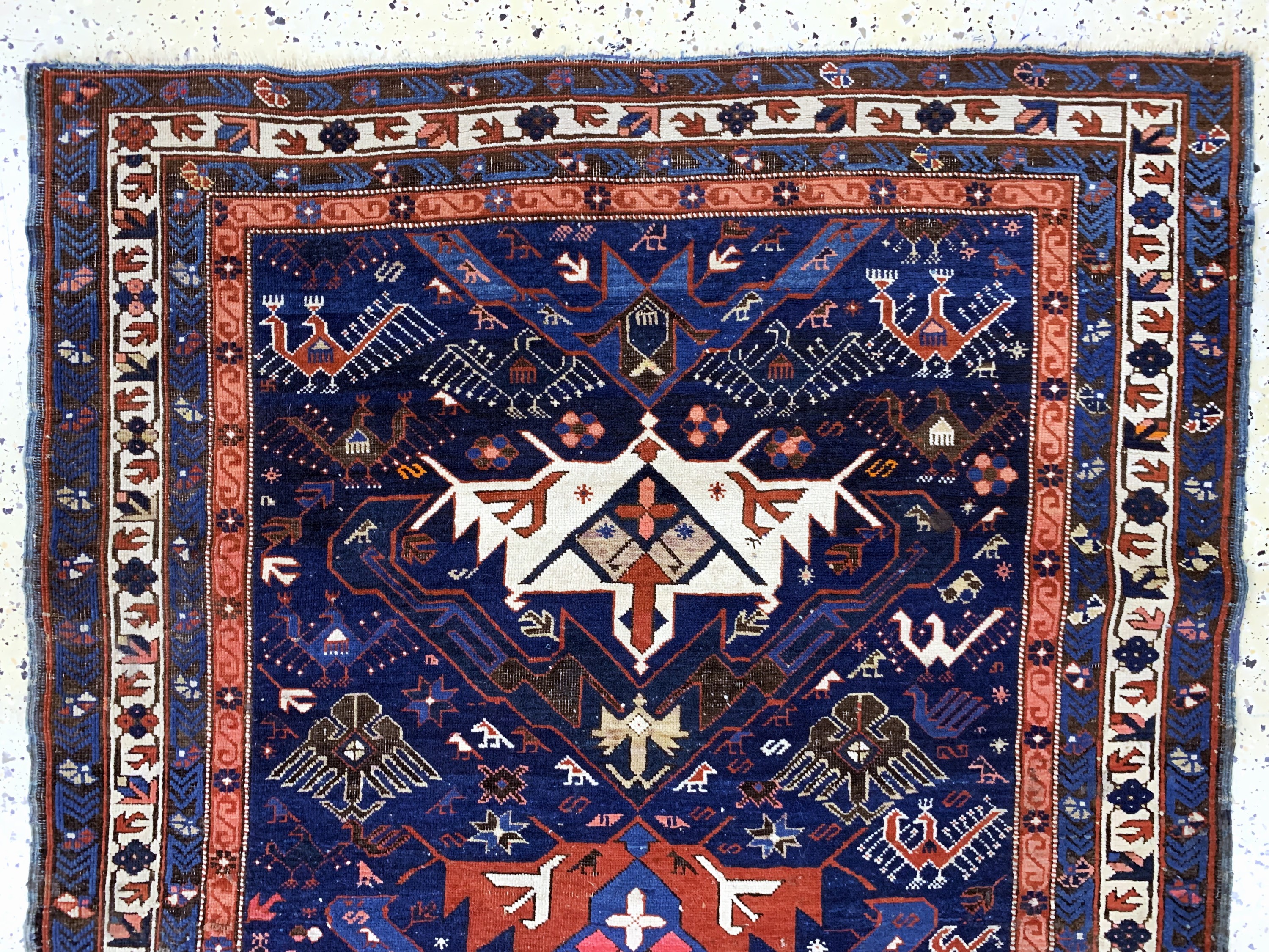 Detail a: Schirwan antik, Kaukasus, 19.Jhd, Wolle aufWolle, ca. 165 x 115 cm, EHZ: 3(kleine restaurierungen).