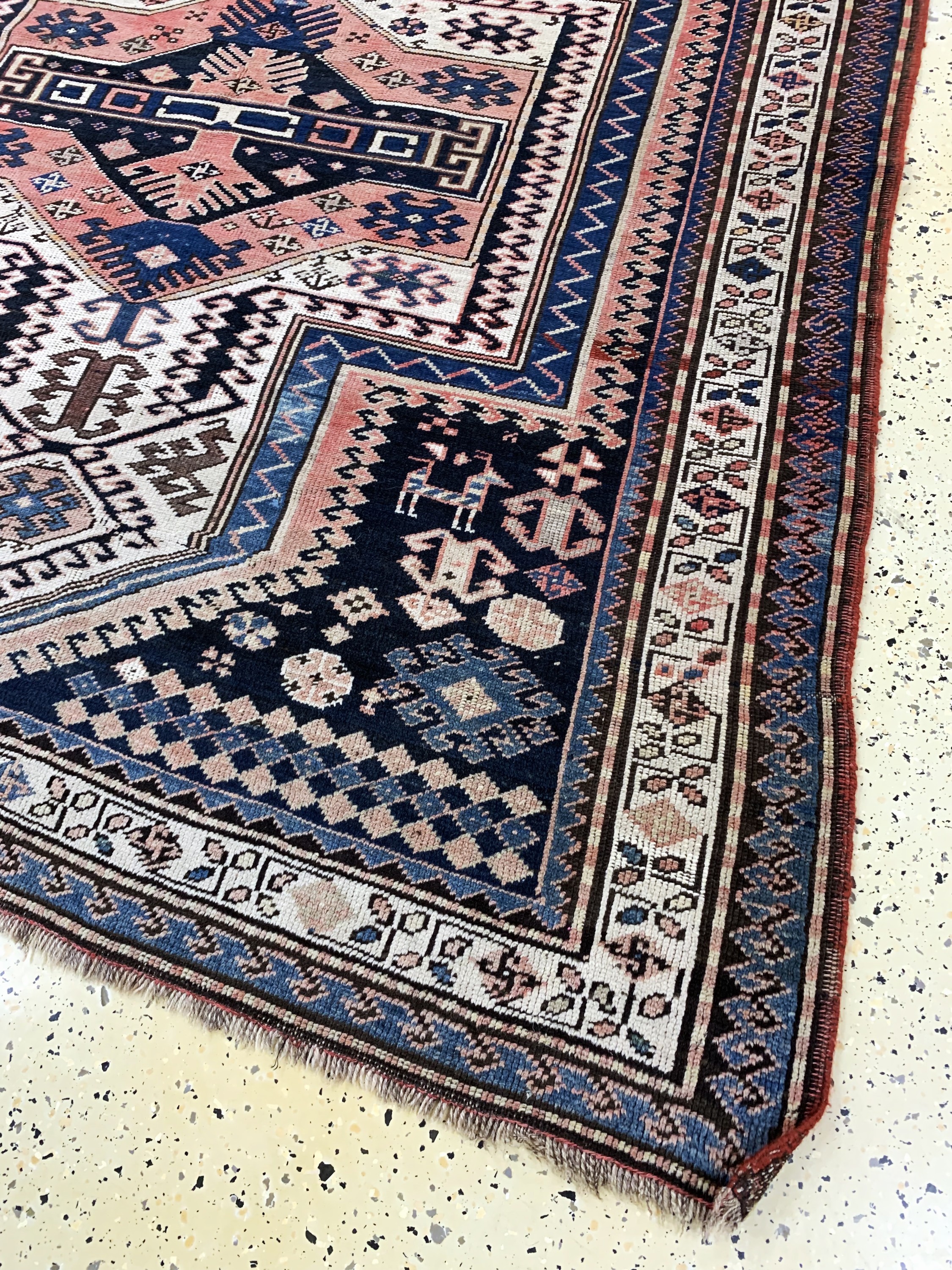 Detail a: "Sewan"Kazak antik, Kaukasus, datiert 1323(1903), Wolle auf Wolle, ca. 200 x 165 cm,EHZ: 2-3(geflickte Stellen).