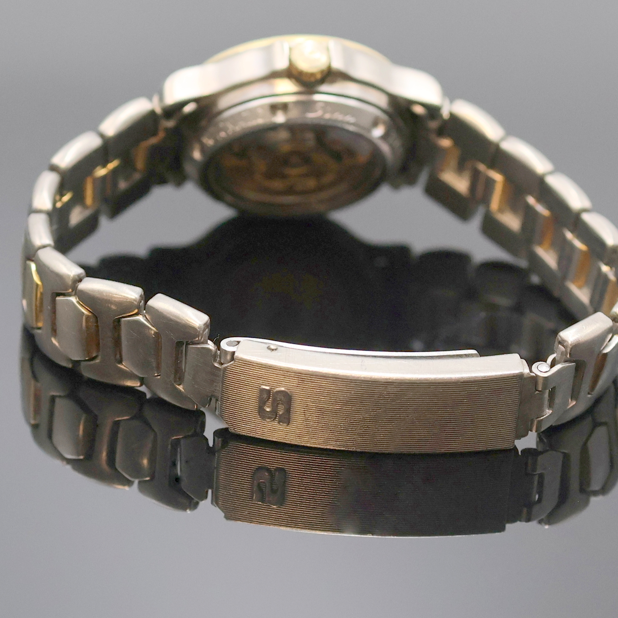 Detail b: SINN Damenarmbanduhr, Automatik, Schweiz um 1990, Titan/Gold kombiniert inkl. z. T. verg. Gliederband m. Faltschl., beids. vergl., Boden und Krone ...