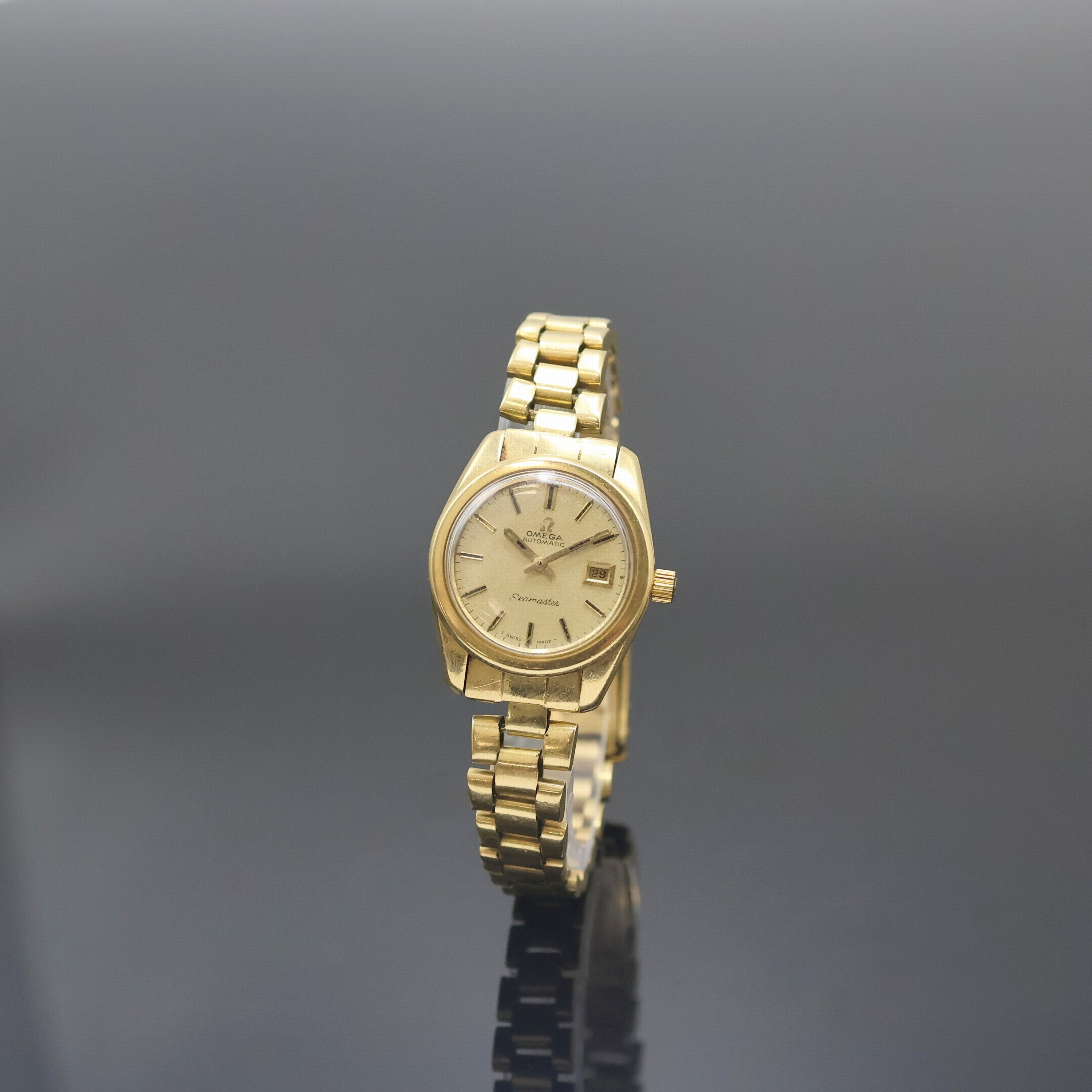 OMEGA Seamaster Damenarmbanduhr in GG 750/000 Referenz 566.0013, Schweiz 1960er Jahre, Automatik, orig. Goldband m. Faltschl., verschr. Boden m. ...