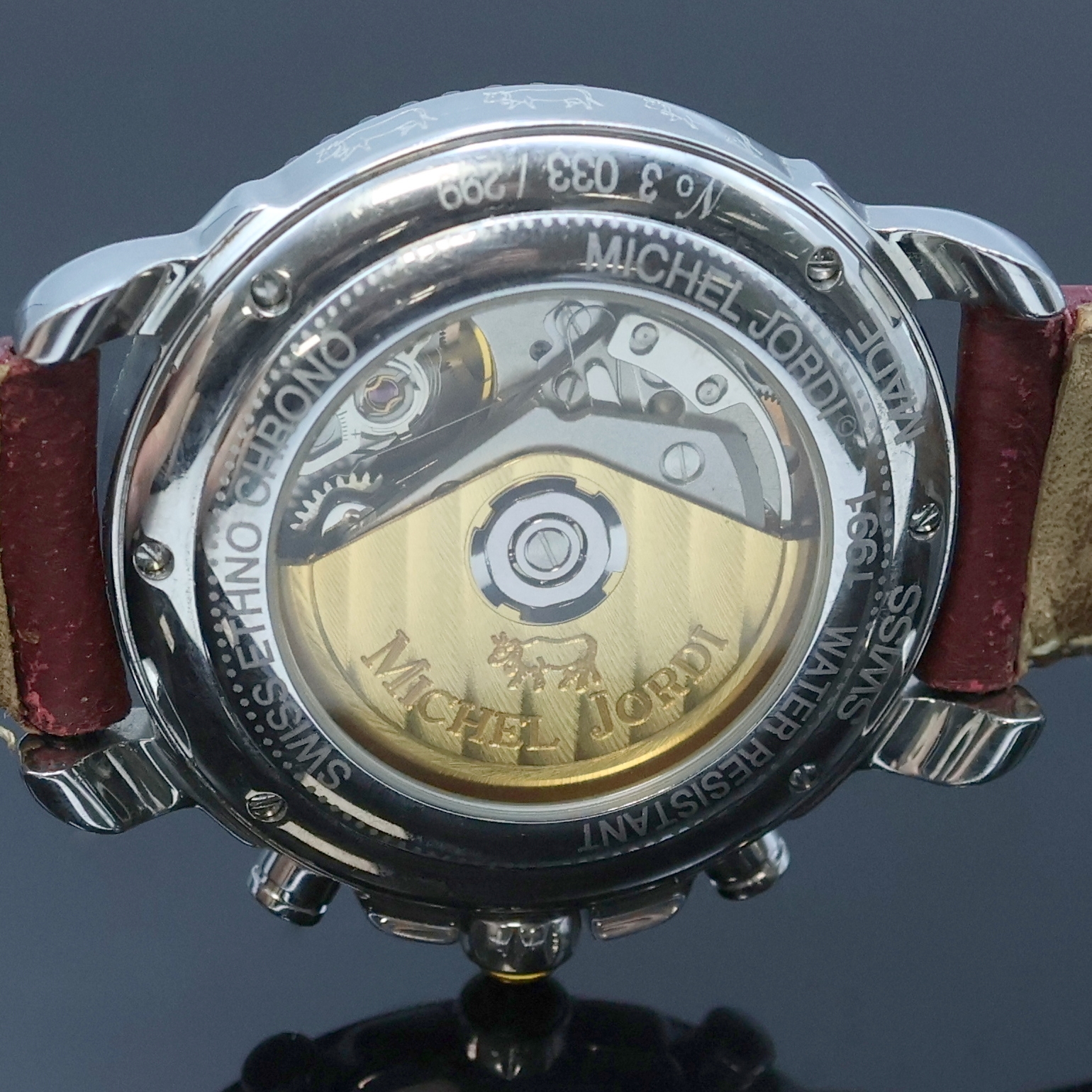 Detail e: MICHEL JORDI auf 299 Stück limitierter Armbandchronograph Ethno Chrono, Automatik, Schweiz um 1991, Edelstahlgeh. inkl. orig. Lederband m. orig. ...