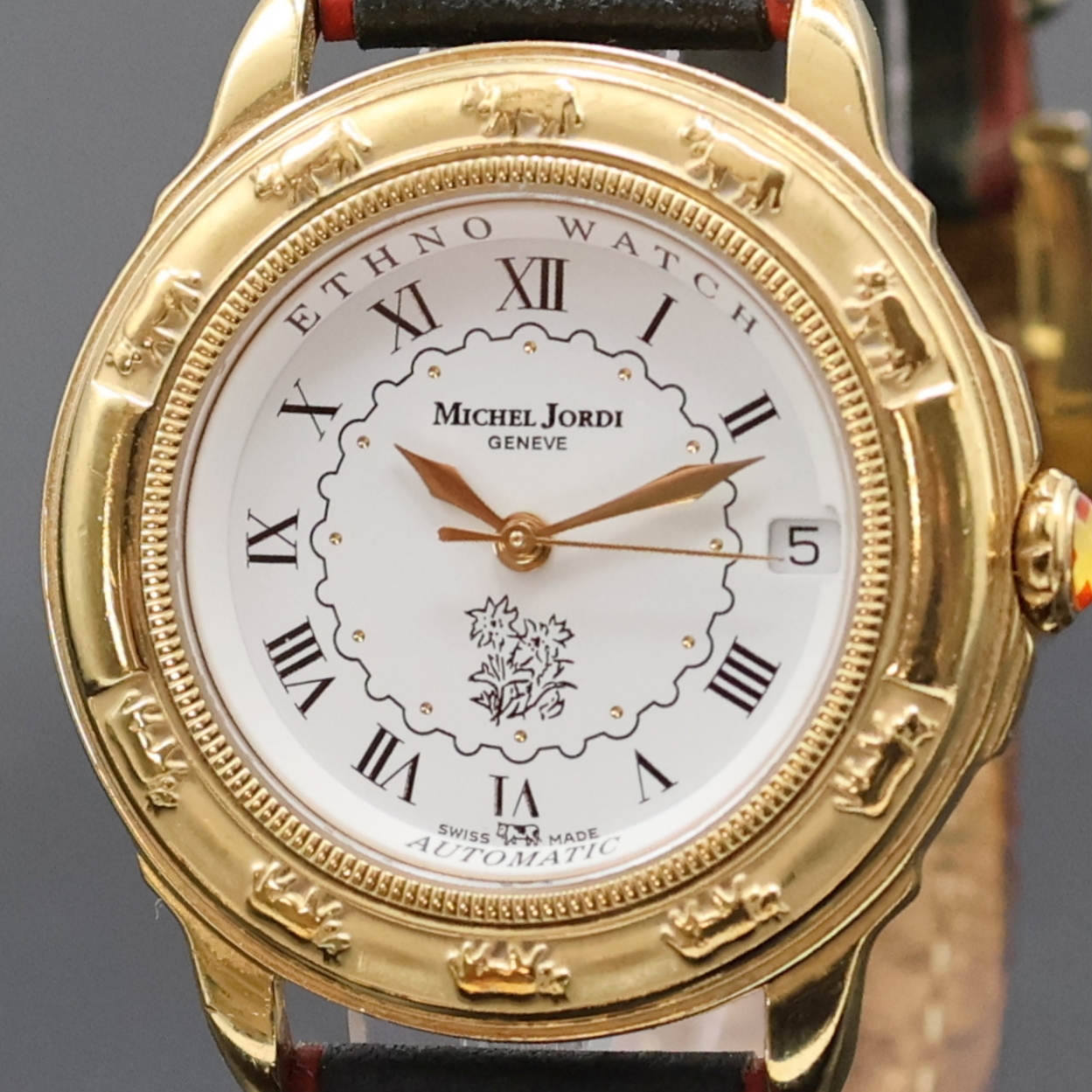 Detail a: MICHEL JORDI auf 9999 Stück limitierte Armbanduhr, Automatik, Schweiz um 1991, verg. Geh. inkl. orig. Lederband (zu ern.) m. orig. Dornschl., beids. ...