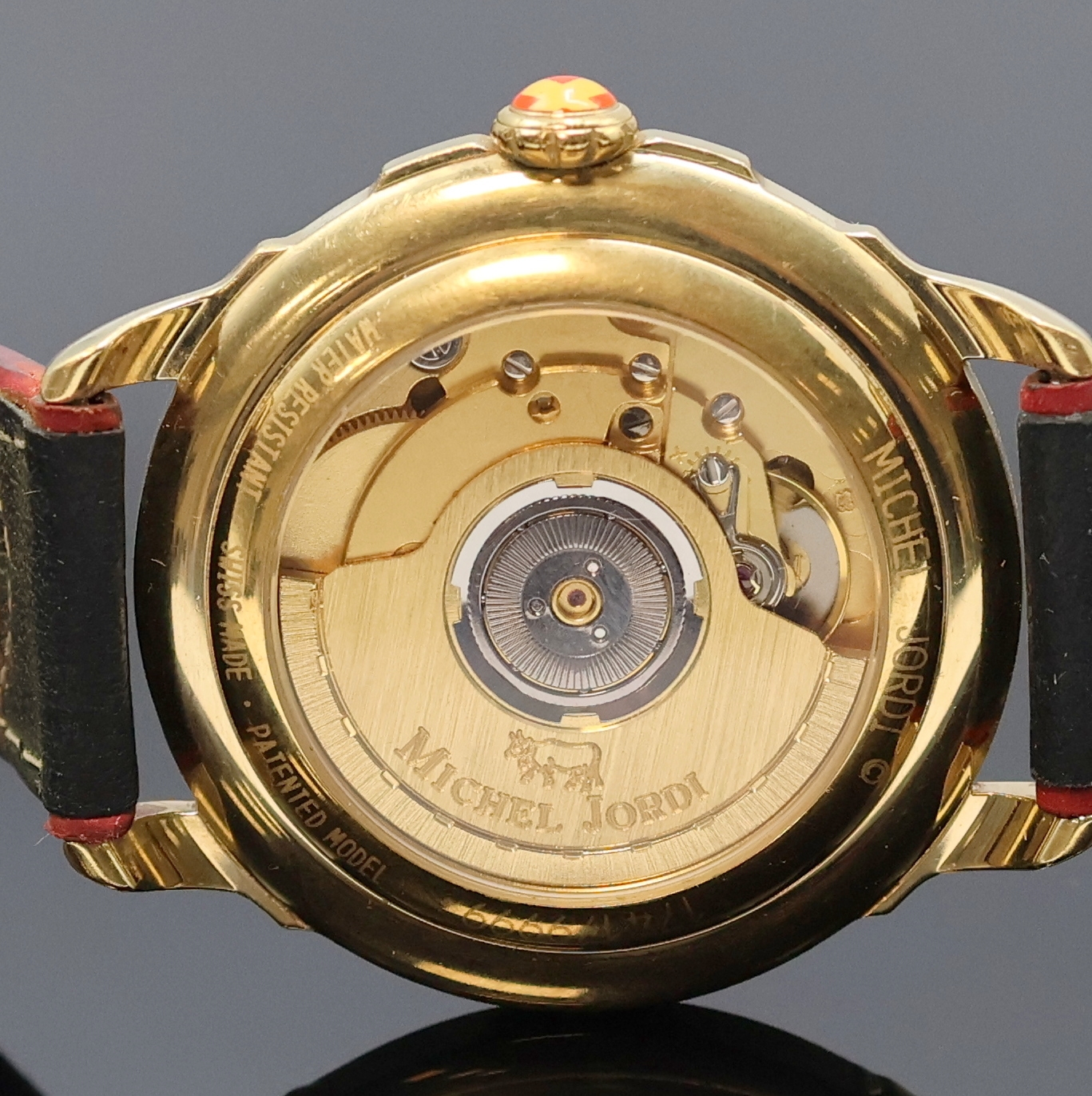 Detail d: MICHEL JORDI auf 9999 Stück limitierte Armbanduhr, Automatik, Schweiz um 1991, verg. Geh. inkl. orig. Lederband (zu ern.) m. orig. Dornschl., beids. ...