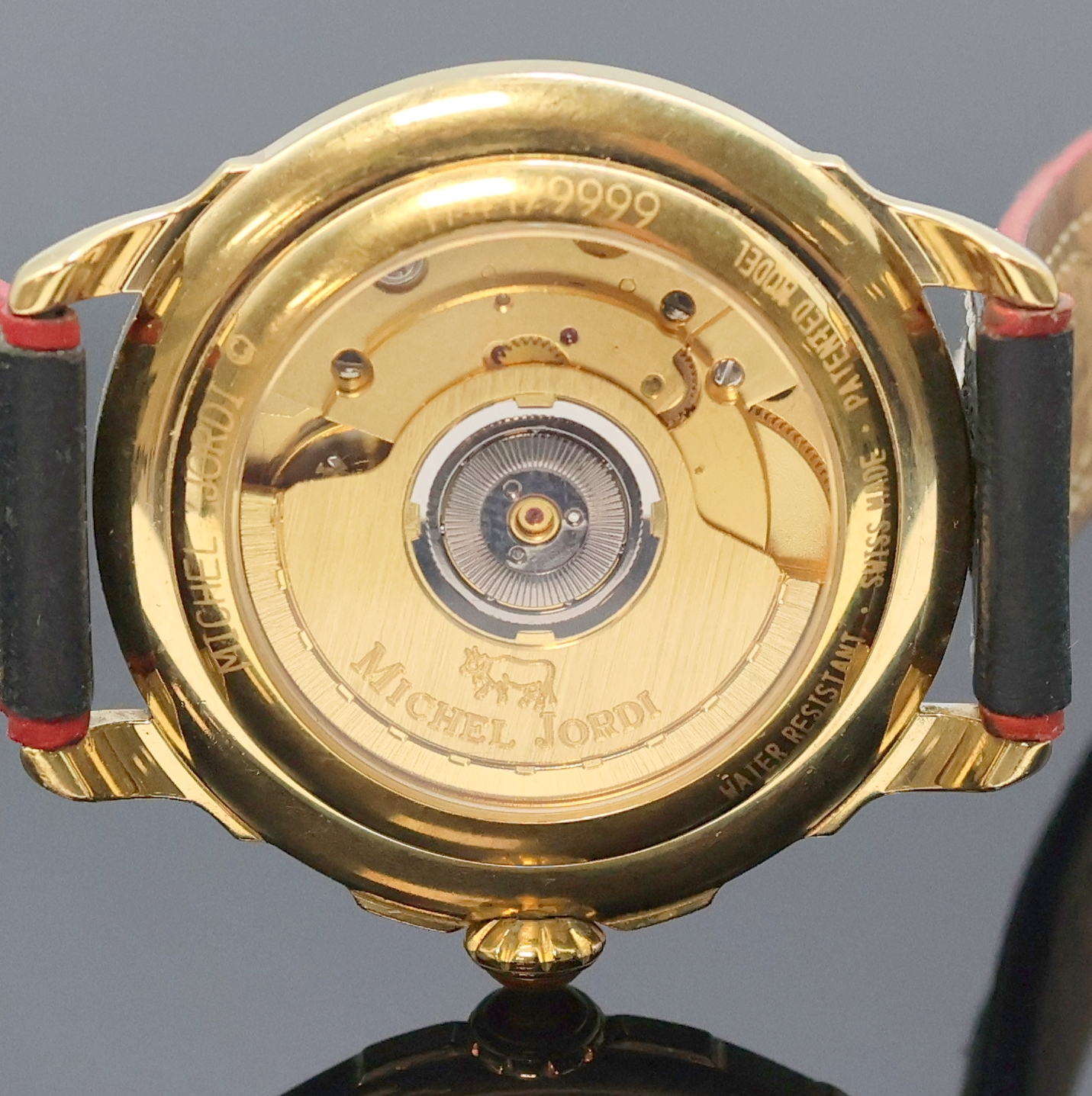 Detail e: MICHEL JORDI auf 9999 Stück limitierte Armbanduhr, Automatik, Schweiz um 1991, verg. Geh. inkl. orig. Lederband (zu ern.) m. orig. Dornschl., beids. ...