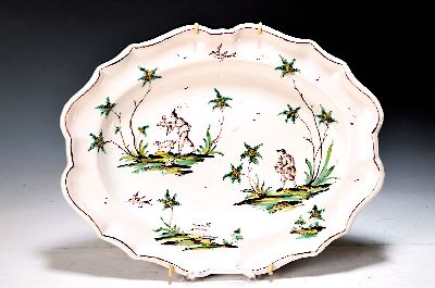Faience plate, Felice Clerici, Milan, 2nd halfof 18th century, faience, faconed form, painting with type. Stylized flora, two figures and birds, ...