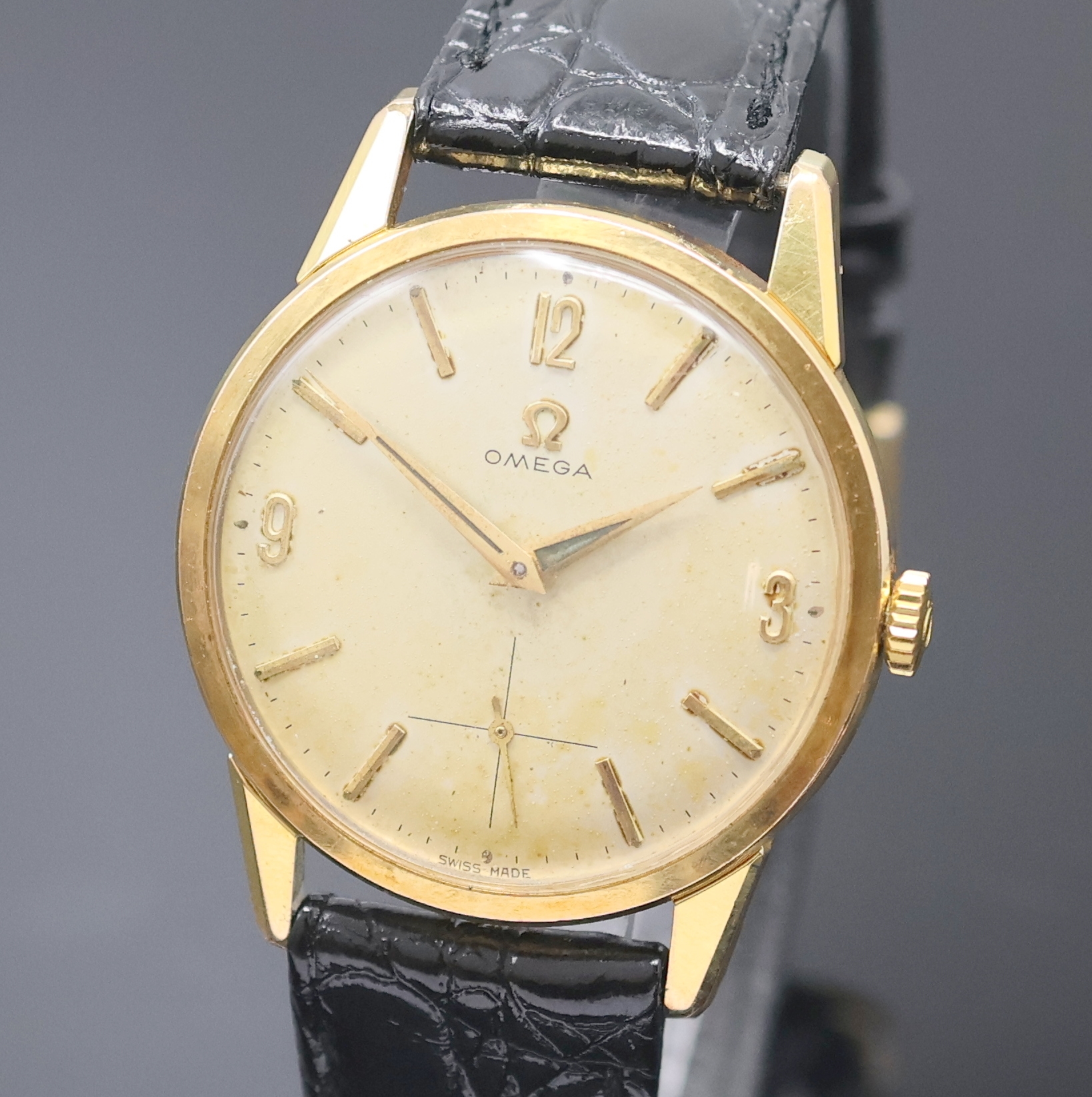 Detail a: Omega Herrenarmbanduhr Referenz 14391-62, Handaufzug, Schweiz um 1962, verg. Geh., Edelstahlboden aufgedr., silb. Zifferbl. m. aufgel. Indizes ...