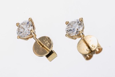 Paar 14 kt Gold Brillant-Ohrstecker,  GG 585/000, 2 Brillanten zus. ca. 1.18 ct Weiß- l.get.Weiß/si