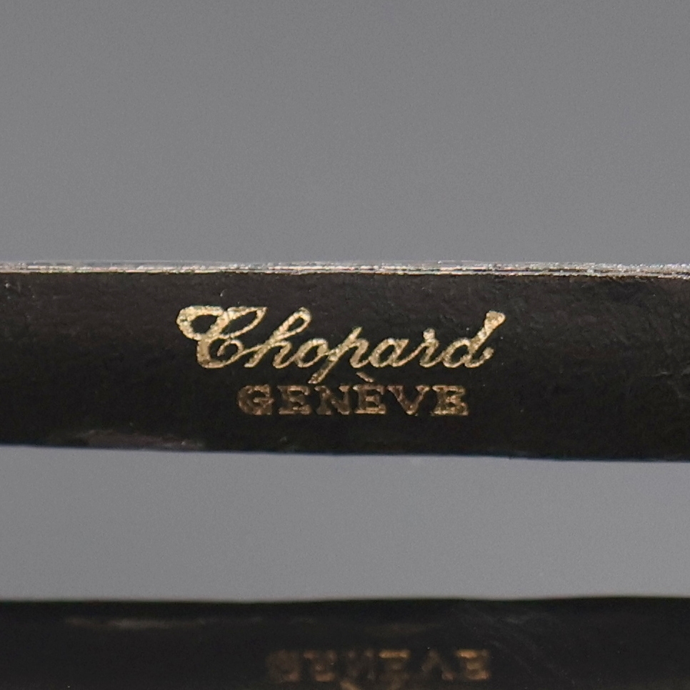 Detail e: CHOPARD Damenarmbanduhr in GG 750/000, Schweiz um 1975, quarz, Boden aufgedr., orig. Lederband m. verg. Dornschl., goldfarb. Zifferbl. m. gold. ...