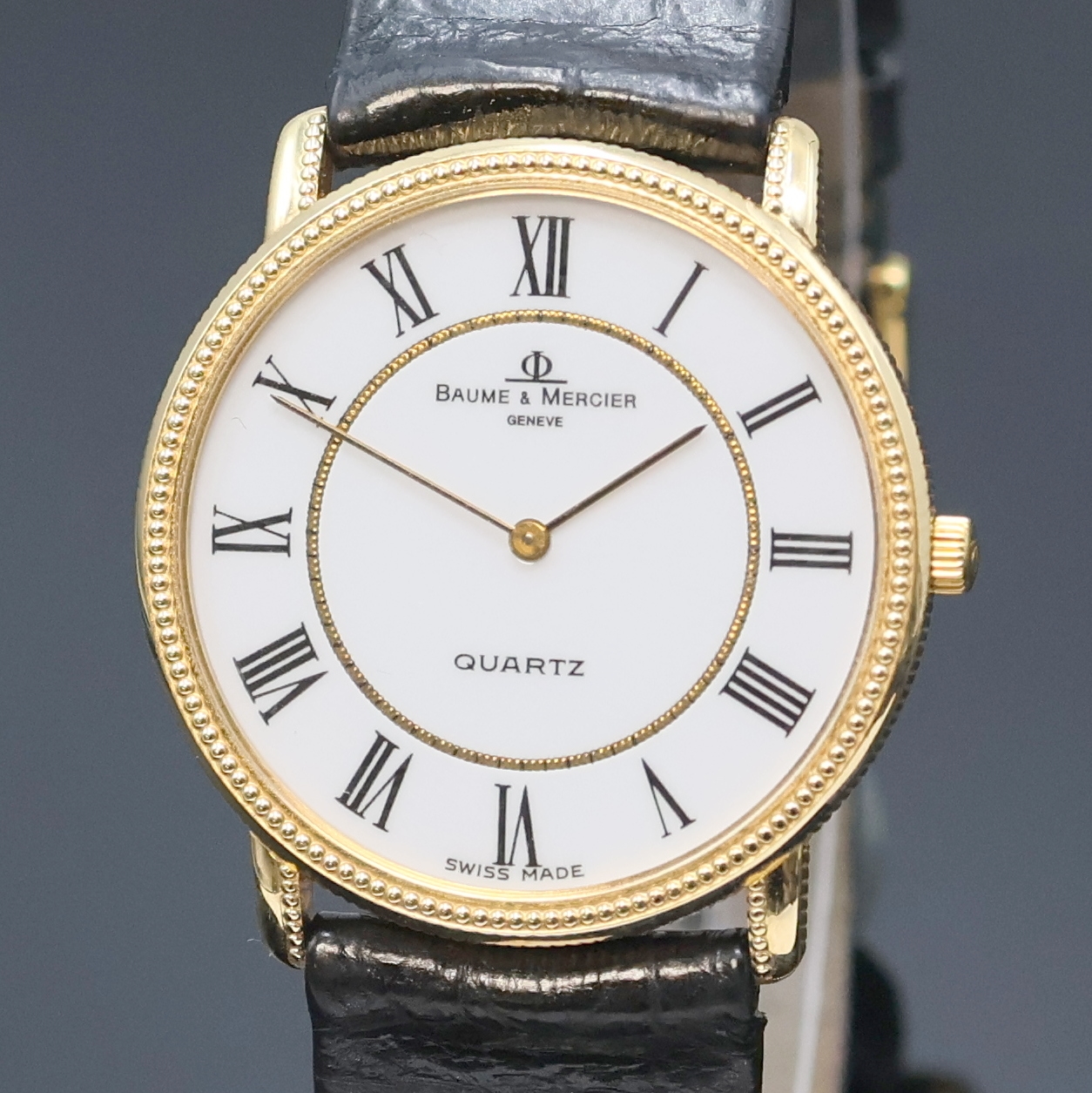 Detail a: BAUME & MERCIER elegante Armbanduhr in GG 750/000 Referenz 15101, Schweiz um 1990, quarz, 2-tlg. Geh. m. Münzrand u. Perllünette,Boden aufgedr., ...