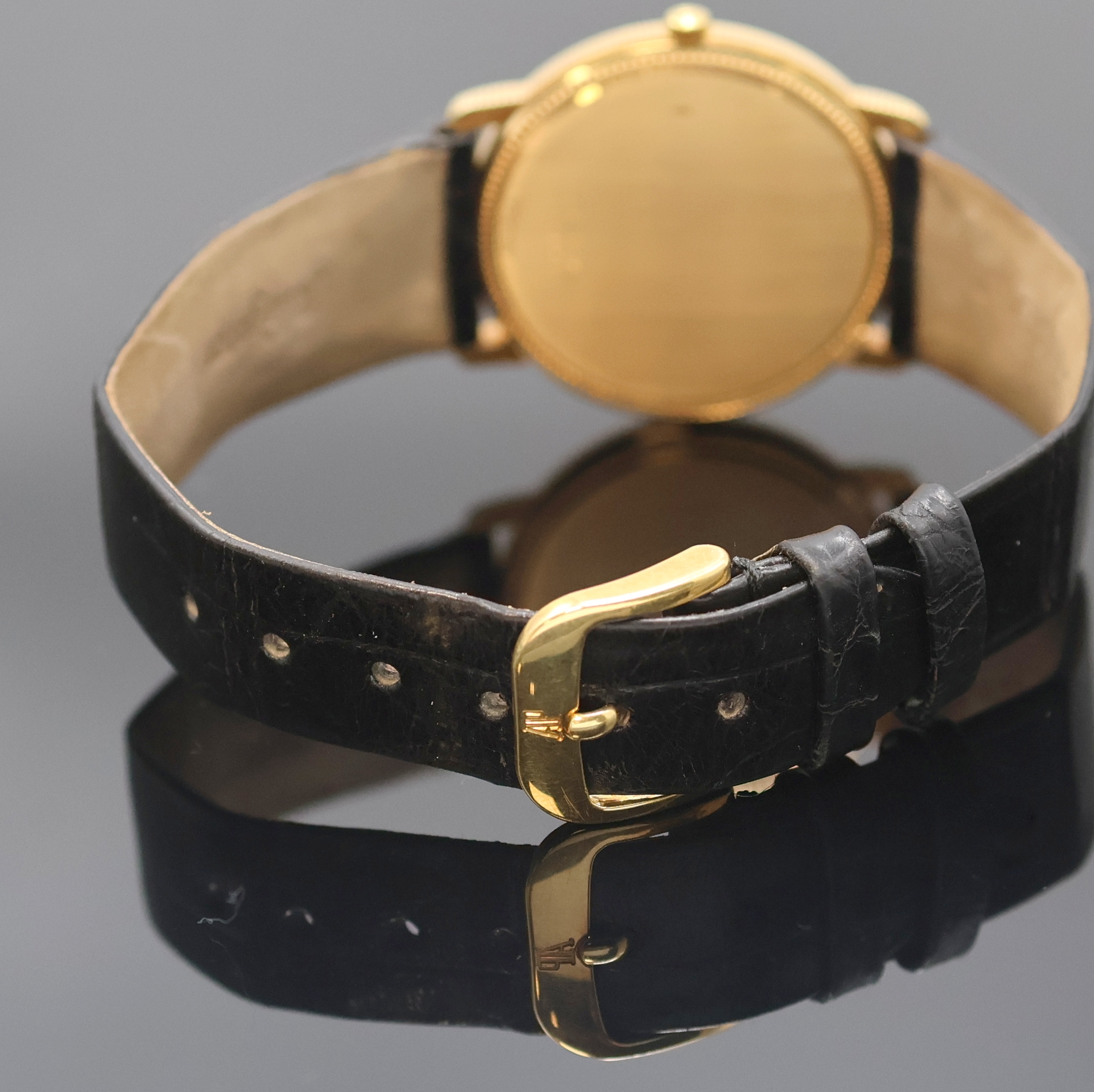Detail b: BAUME & MERCIER elegante Armbanduhr in GG 750/000 Referenz 15101, Schweiz um 1990, quarz, 2-tlg. Geh. m. Münzrand u. Perllünette,Boden aufgedr., ...
