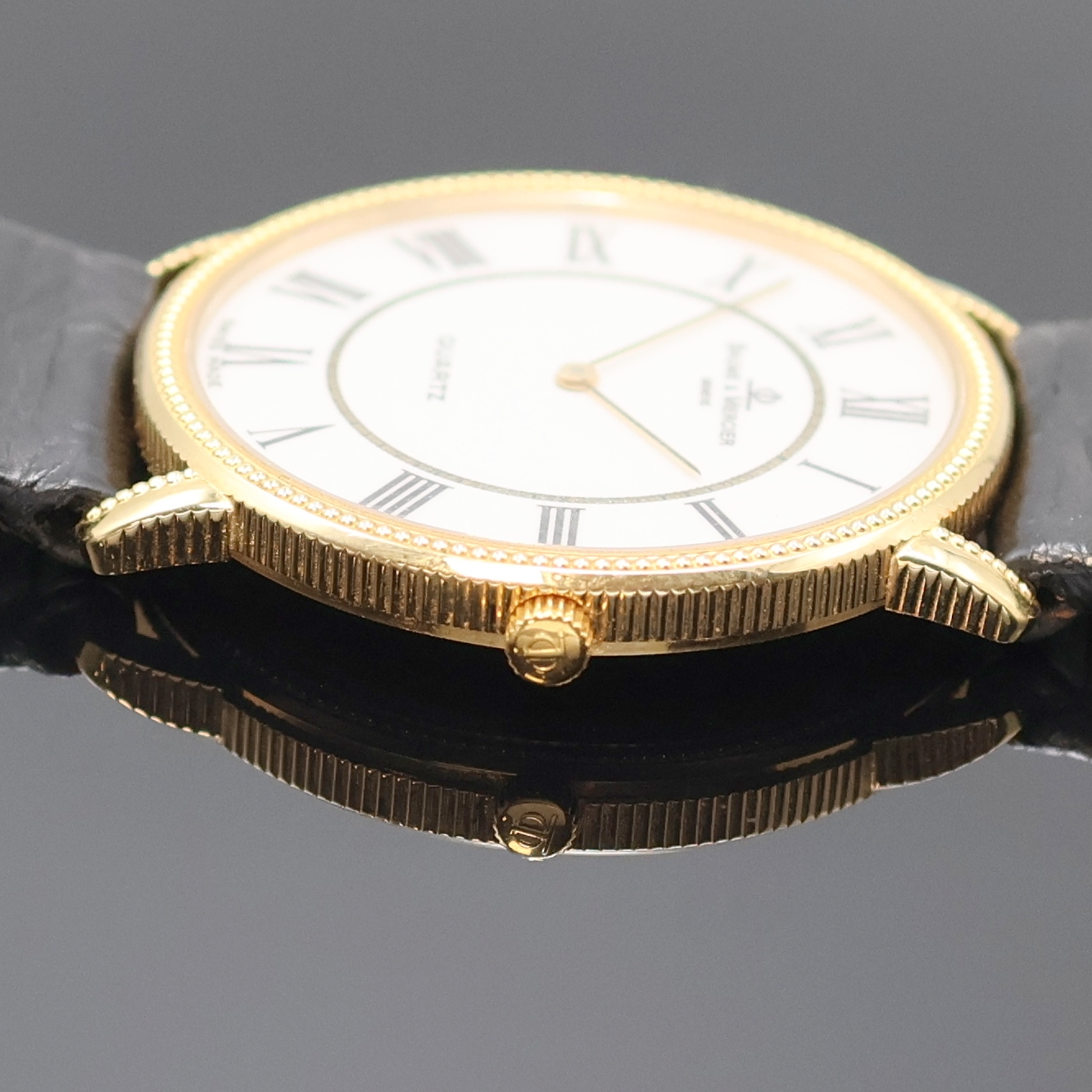 Detail c: BAUME & MERCIER elegante Armbanduhr in GG 750/000 Referenz 15101, Schweiz um 1990, quarz, 2-tlg. Geh. m. Münzrand u. Perllünette,Boden aufgedr., ...