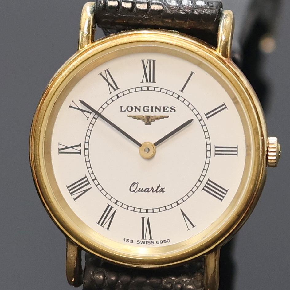 Detail b: LONGINES Résence Damen/Herren 2 Armbanduhren, Schweiz um 1985, verg. Geh. m. aufgedr. Stahlböden, weiße Zifferblätter, röm. Zahlen, ...