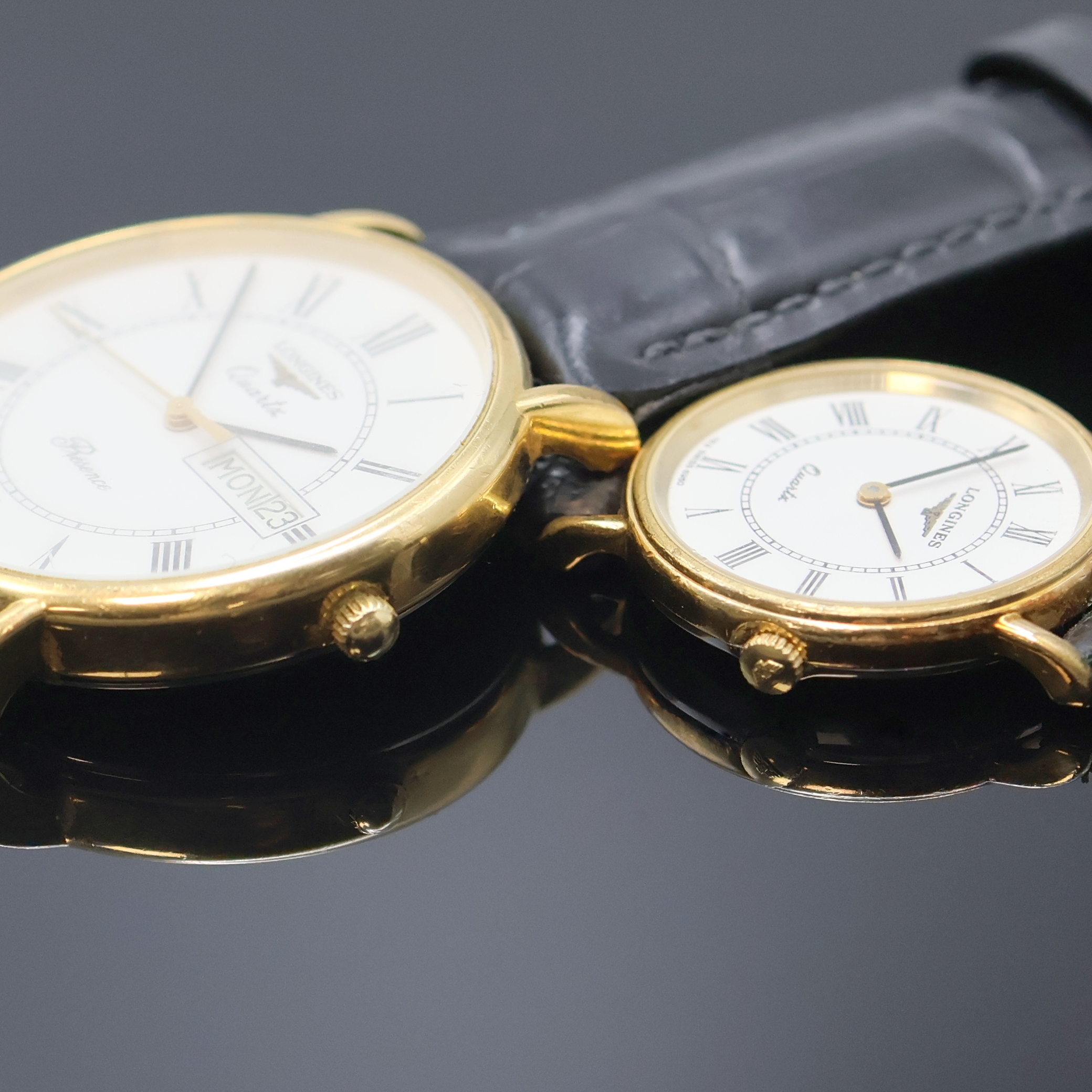 Detail c: LONGINES Résence Damen/Herren 2 Armbanduhren, Schweiz um 1985, verg. Geh. m. aufgedr. Stahlböden, weiße Zifferblätter, röm. Zahlen, ...