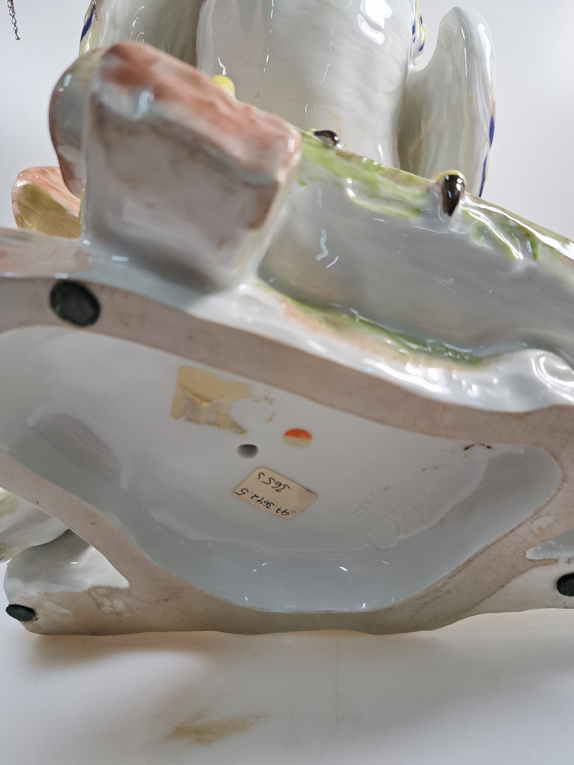 Detail j: Große Porzellanfigur, Meissen, um 1900, Entwurf J.J. Kaendler 1741, Haushahn auf Holzstoss, reich bunt bemalt, eine Schwanzfeder fehlt, H. ca. 40cm, ...