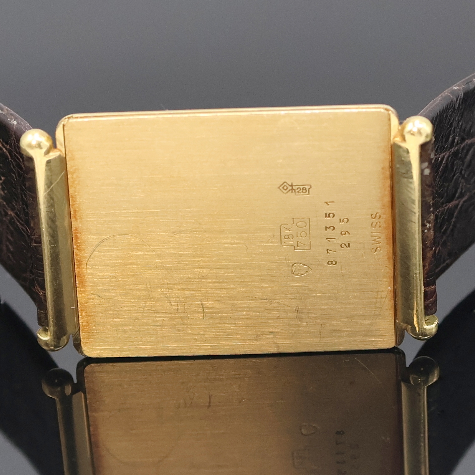 Detail g: DUGENA ultraflache Armbanduhr in GG 750/000 Referenz 87135 295, Schweiz um 1978, orig. Lederband m. verg. orig. Dornschl., LCD Display, Kal. ESA ...