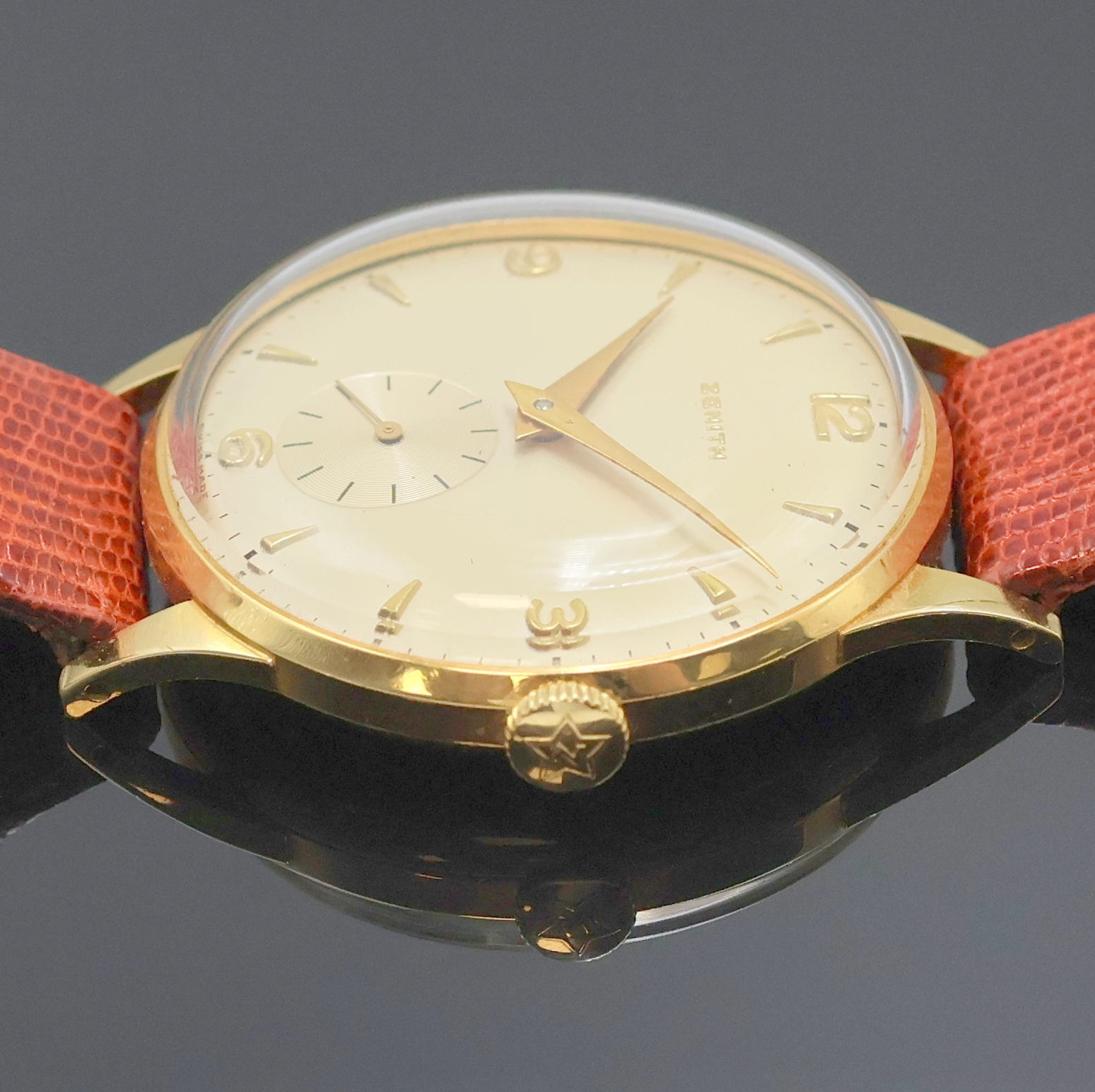Detail e: ZENITH Armbanduhr in GG 750/000, Schweiz um 1950, Handaufzug, 2-teil. Geh., Boden aufgedr., orig. Krone, versilb. Zifferbl., gold. Indizes u. Zahlen, ...
