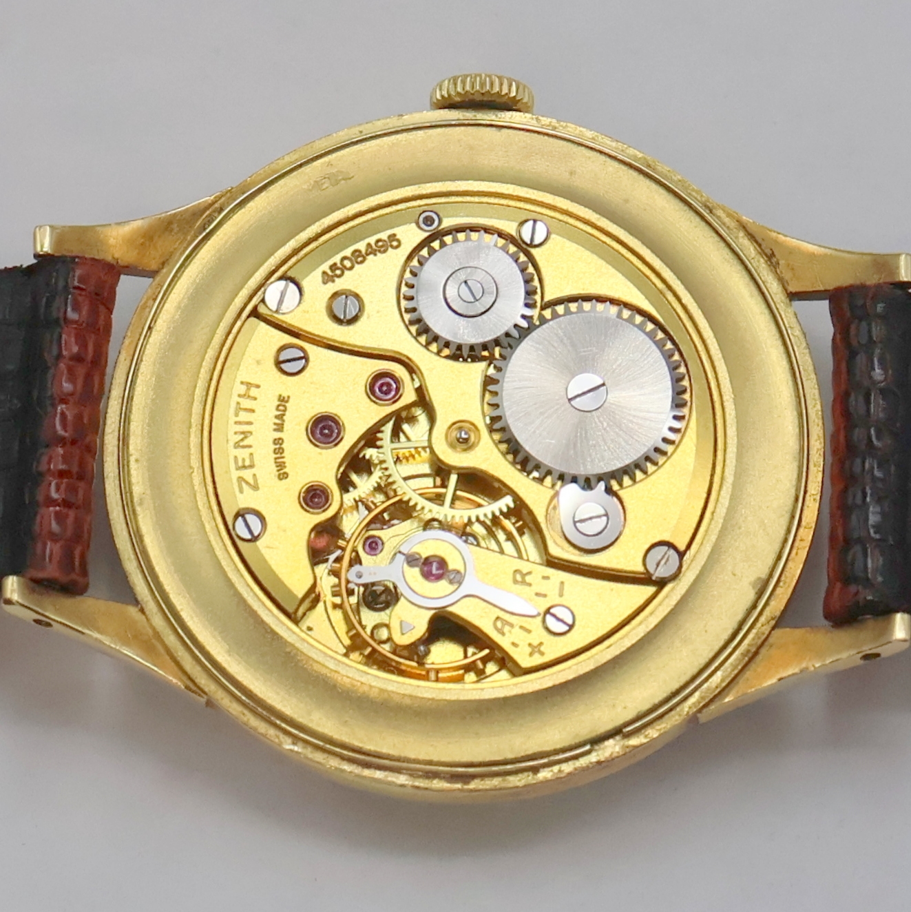 Detail g: ZENITH Armbanduhr in GG 750/000, Schweiz um 1950, Handaufzug, 2-teil. Geh., Boden aufgedr., orig. Krone, versilb. Zifferbl., gold. Indizes u. Zahlen, ...