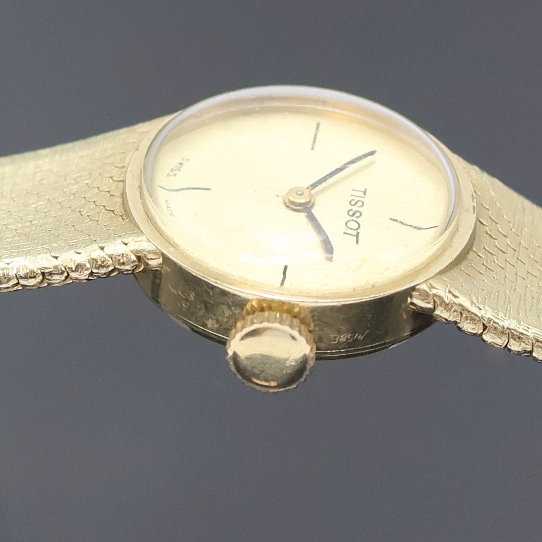 Detail c: TISSOT Damenarmbanduhr in GG 585/000, Schweiz um 1970, Handaufzug, 2-teil. Geh., Boden aufgedr., gold. Zifferbl., schwarze Zeiger, vernick. Werk Kal. ...