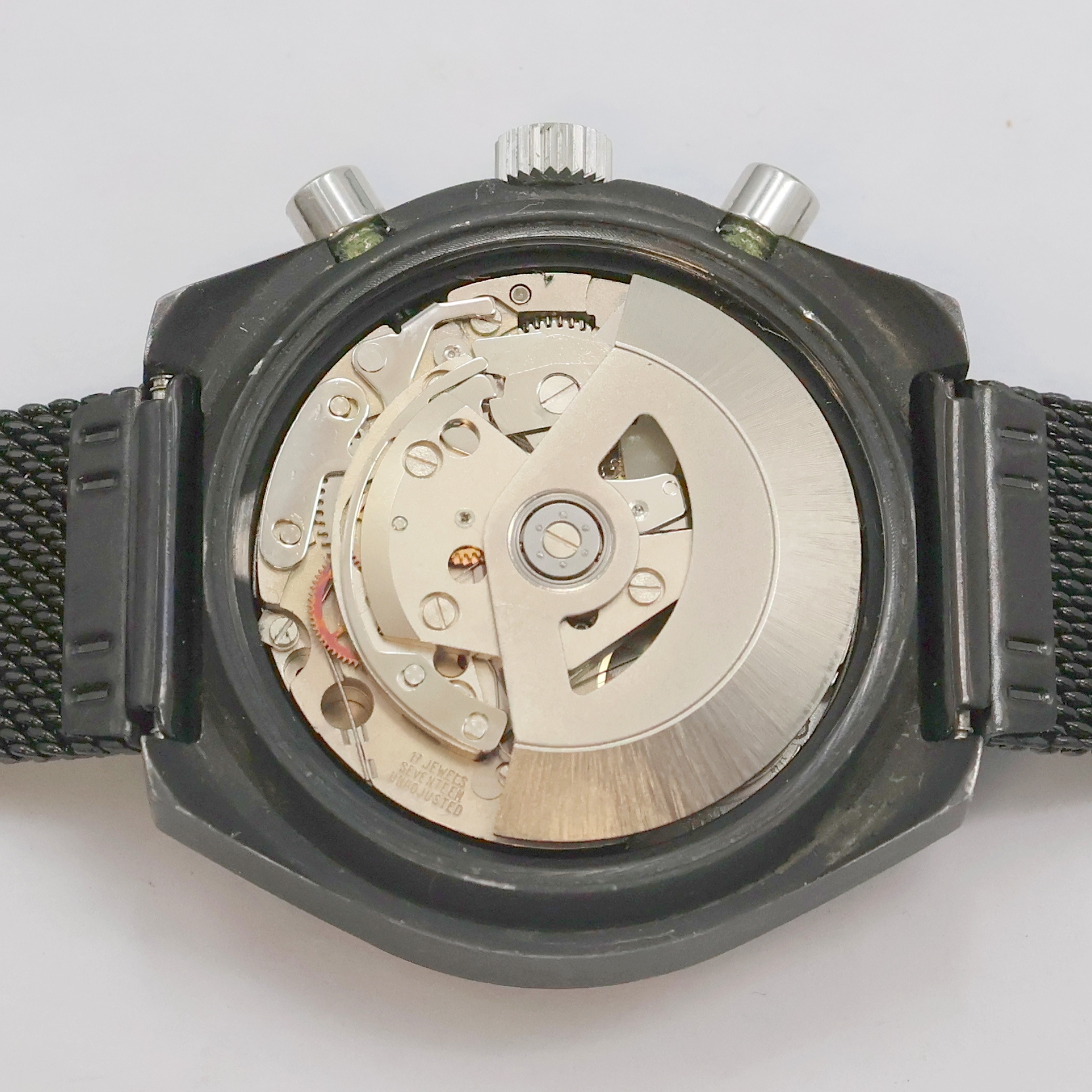 Detail g: DUGENA Herrenchronograph, Schweiz um 1980, Automatik, 2-teil., geschwärztes Edelstahlgeh., verschr. Boden, schwarzes Milanaiseband, schwarzes ...