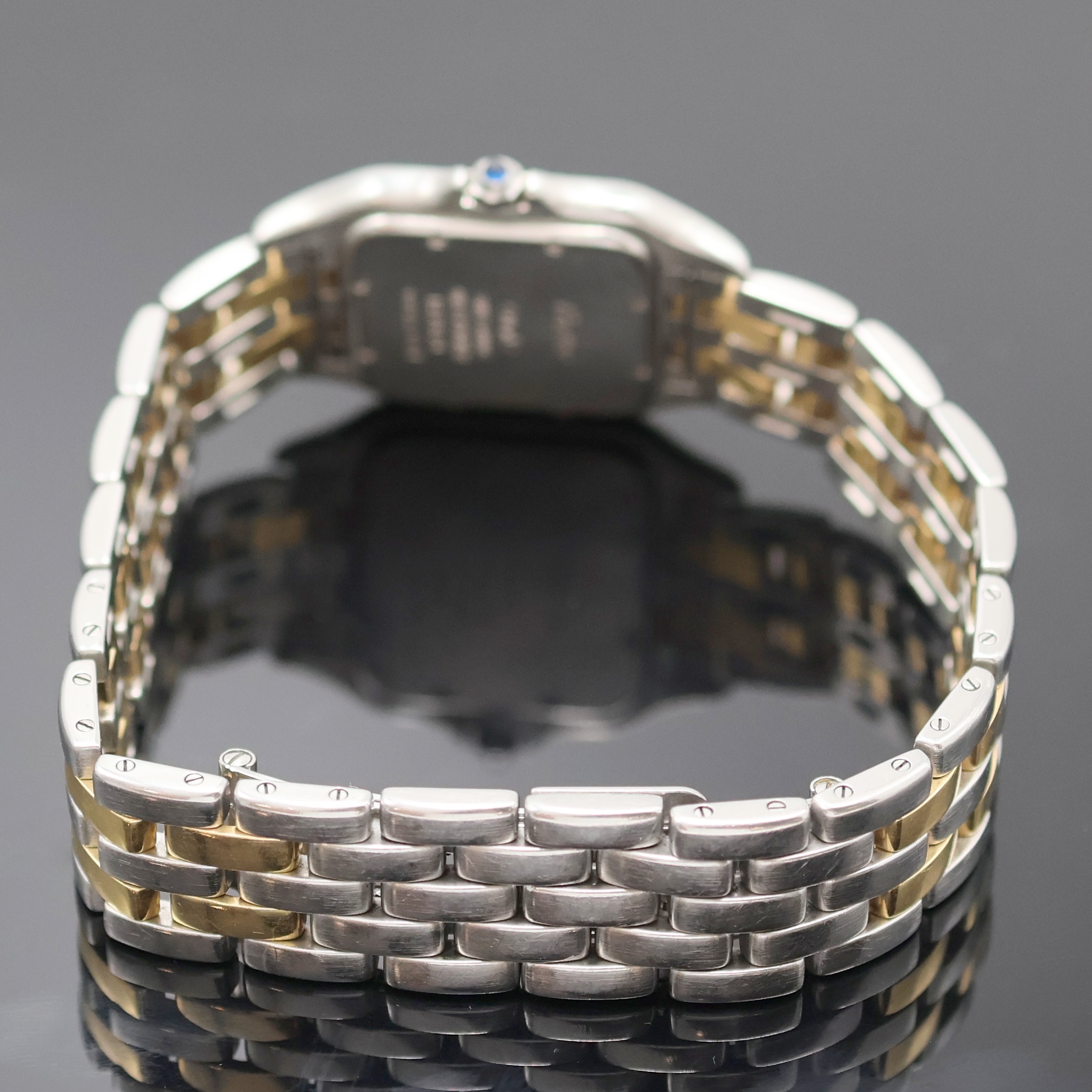 Detail b: CARTIER Herrenarmbanduhr Panthere Referenz 183949, Schweiz um 1990, quarz, Edelstahl/Gold komb. inklusive Gliederband m. dopp. Faltschl., Boden ...