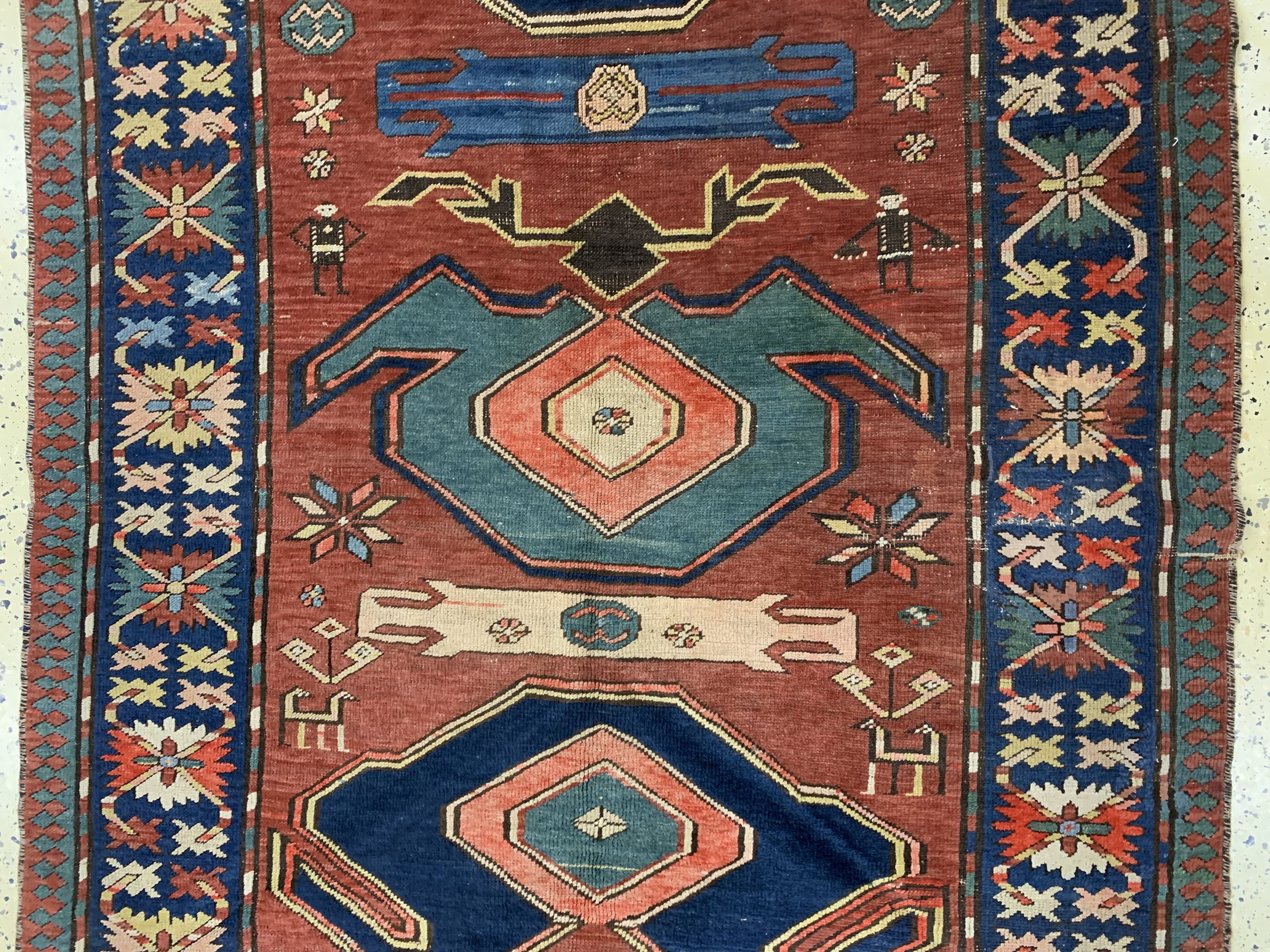 Detail b: Antiker Kazak, Kaukasus, Mitte 19.Jhd, Wolle auf Wolle, ca. 252 x 130 cm, EHZ: 3, (Restaurierungen)