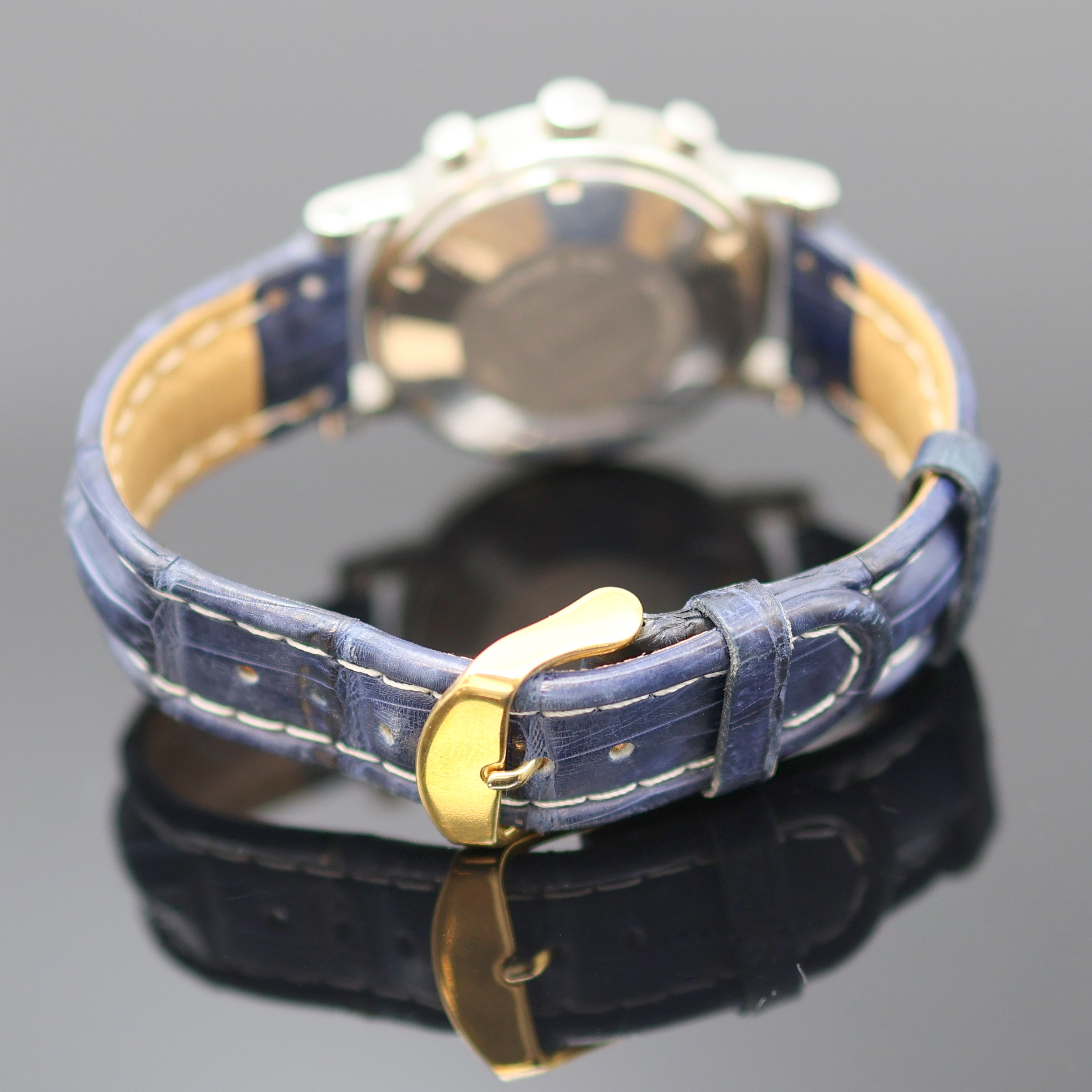Detail c: CORTEBERT Armbandchronograph, Automatik, Schweiz um 1990, Edelstahlgeh., Boden verschr., blues, im Zentrum guill. Zifferbl. m. röm. Std., gold. ...