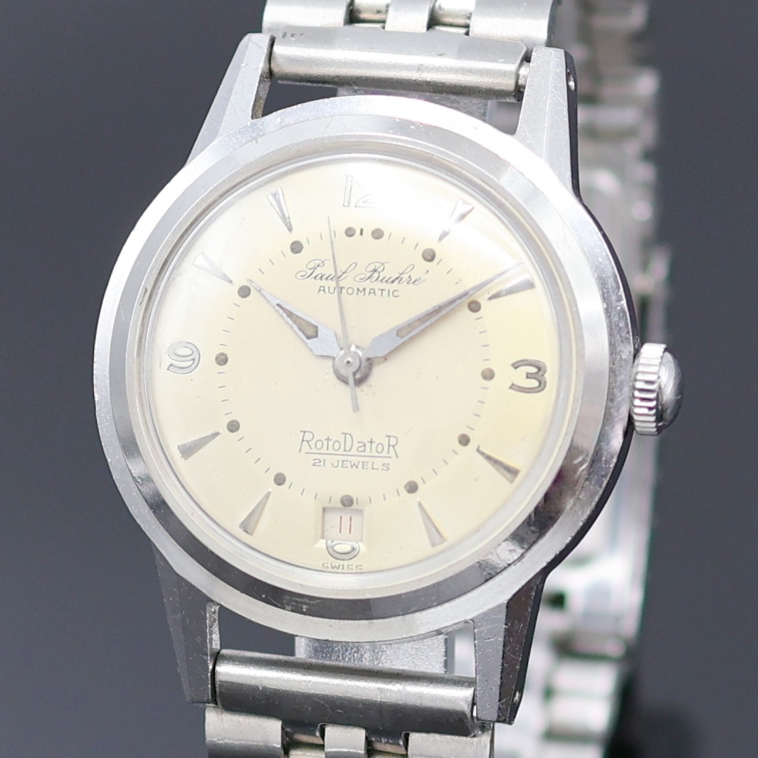 Detail a: PAUL BUHRE Armbanduhr RotoDatoR, Schweiz um 1957, Automatik, Edelstahlgeh. inkl. neutr. Gliederband, Boden verschr., vers. Zifferbl. m. aufges. ...